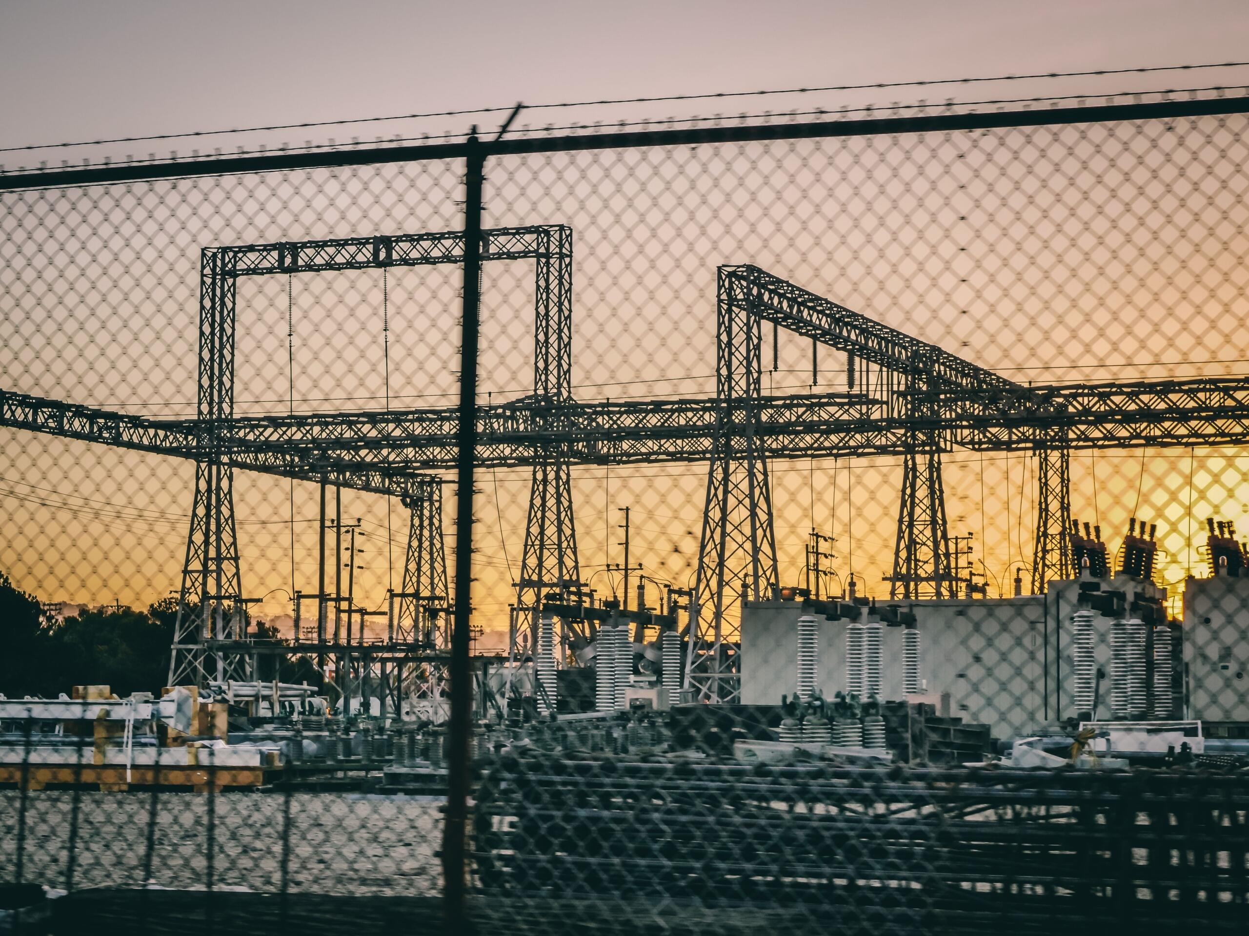 A large power generation station with industrial generators and electrical equipment used to produce electricity.