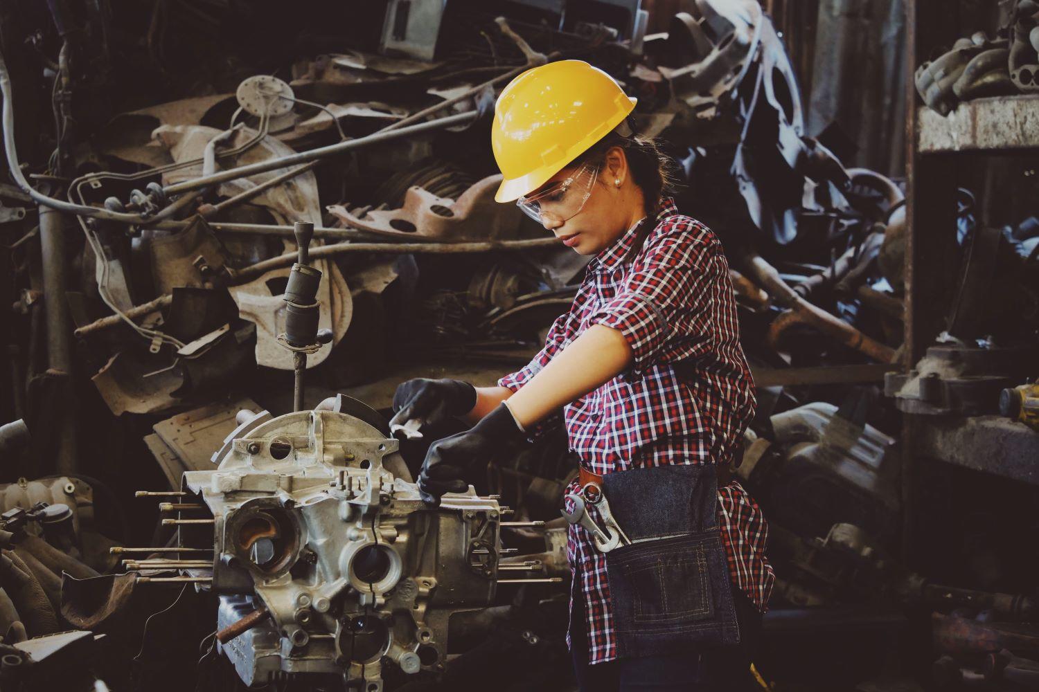 A woman repairing engines