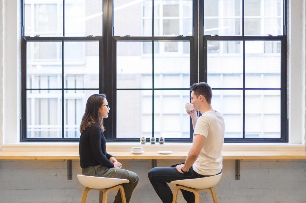 Two people discussing
