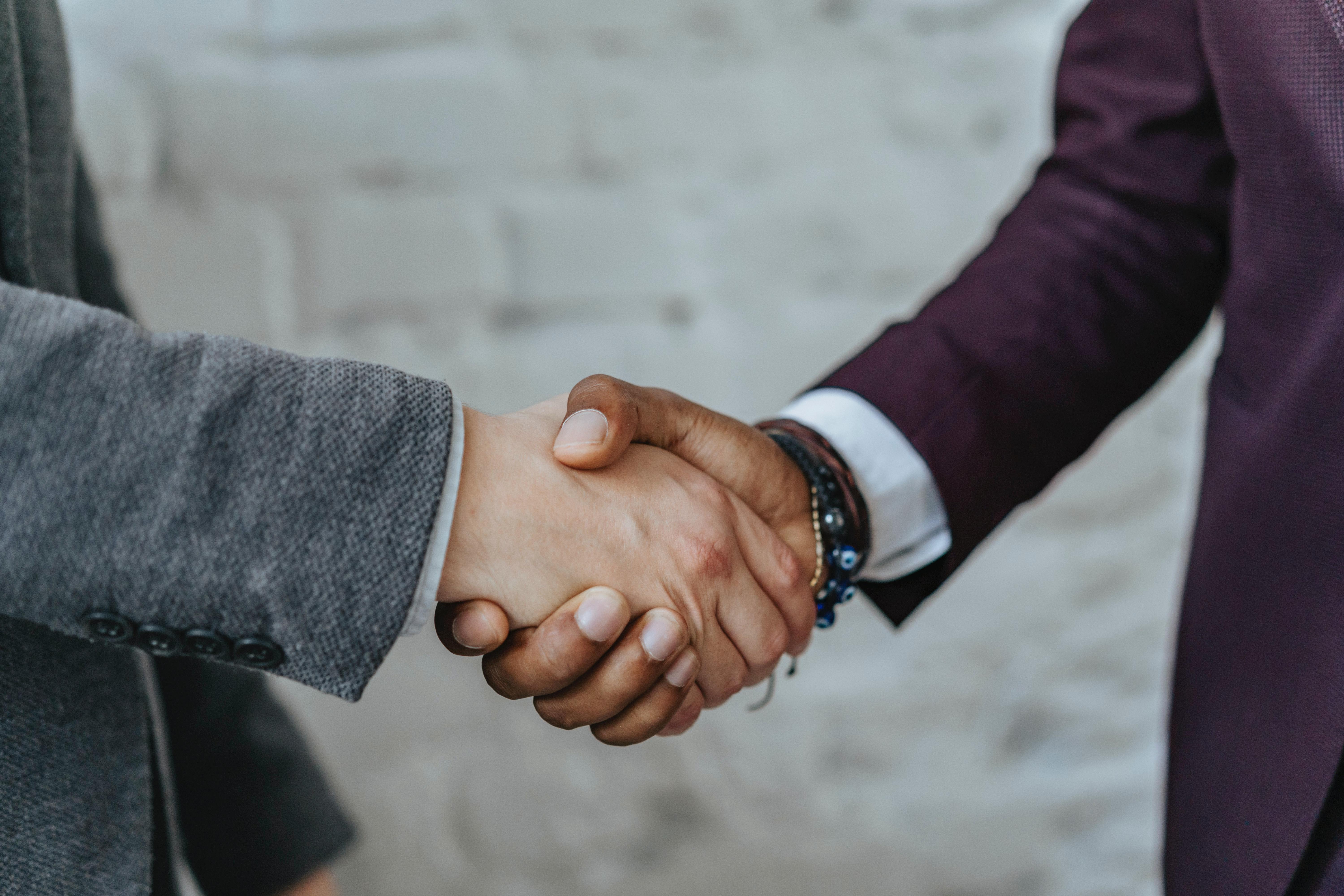 A firm handshake can make a good impression during an interview.
