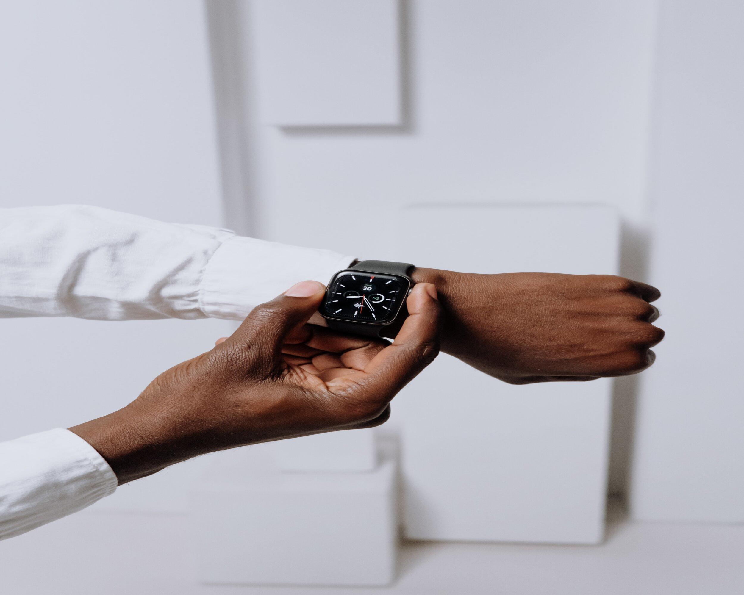 A man looking at his watch
