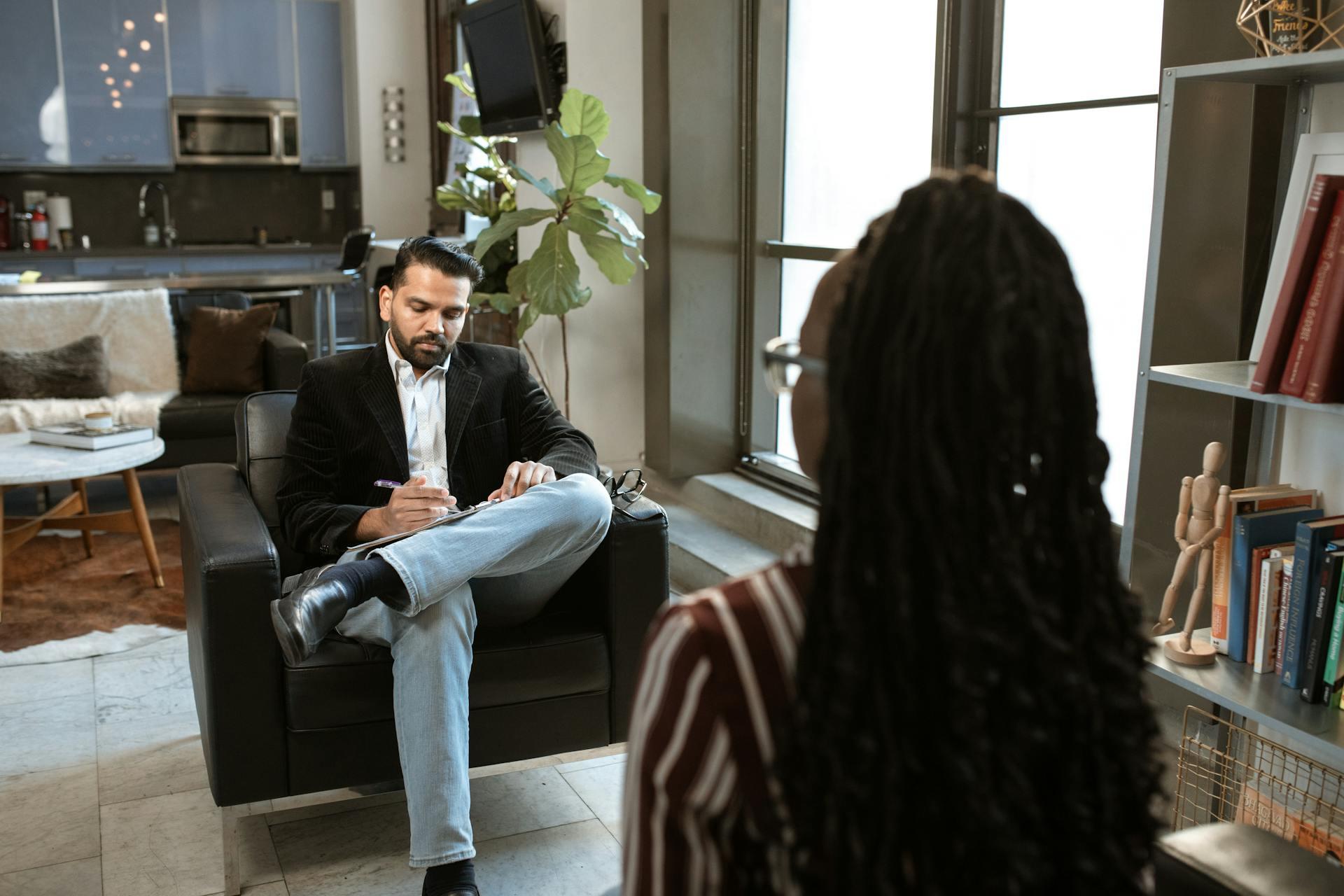 a man interviewing a woman