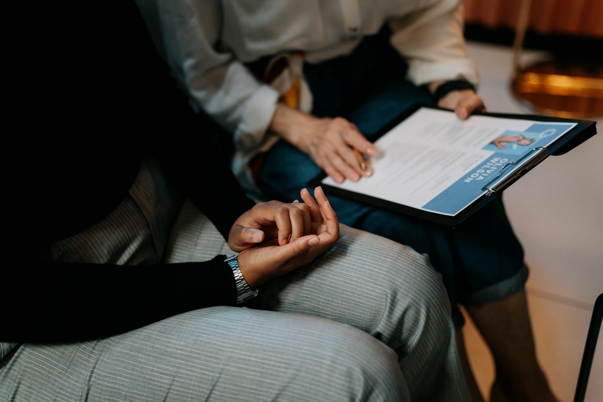 A woman interviewing a man