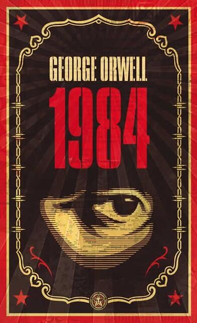 Cover of George Orwell's "1984" featuring a large red title, a stylized watchful eye, and decorative border with stars.