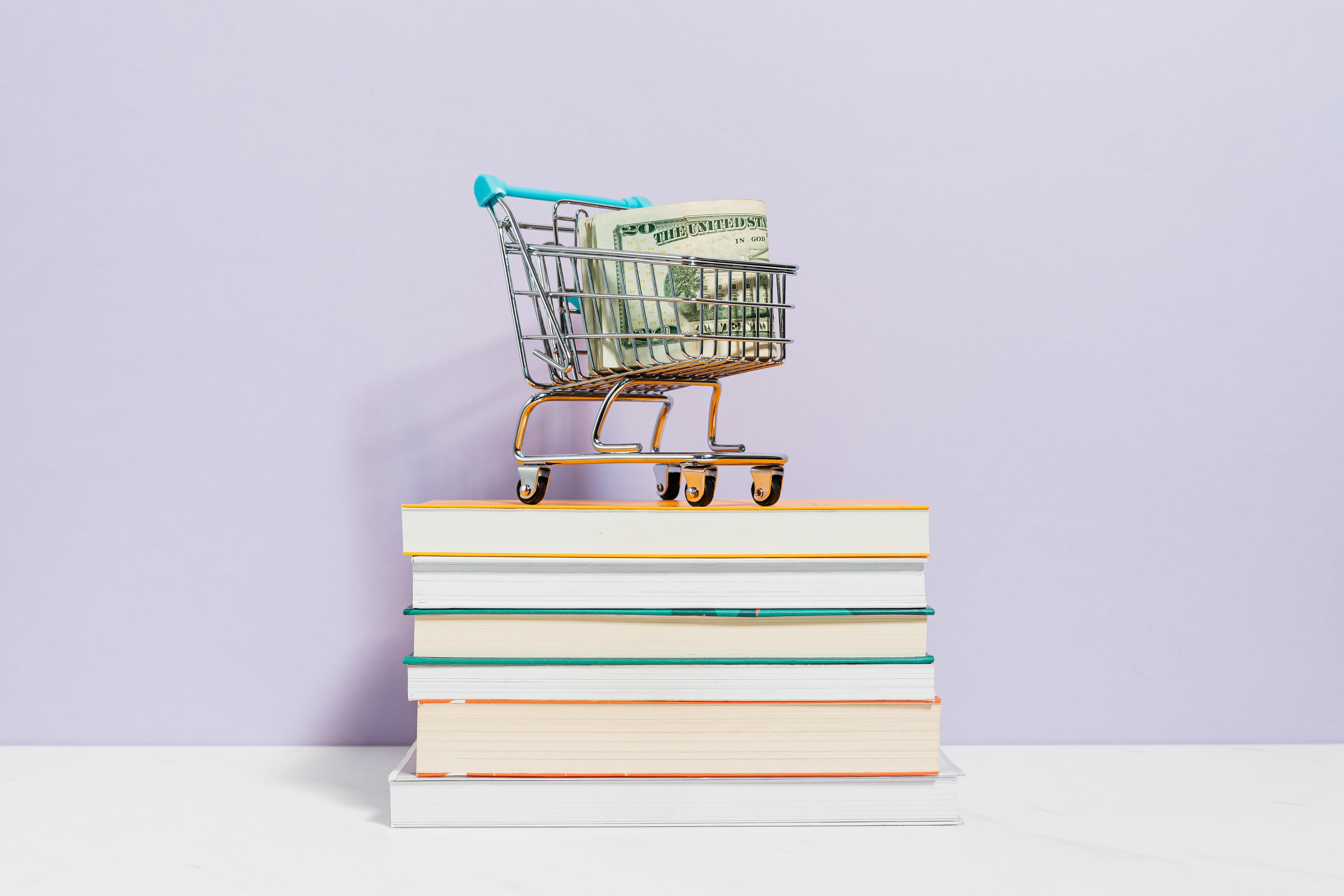Shopping cart on books