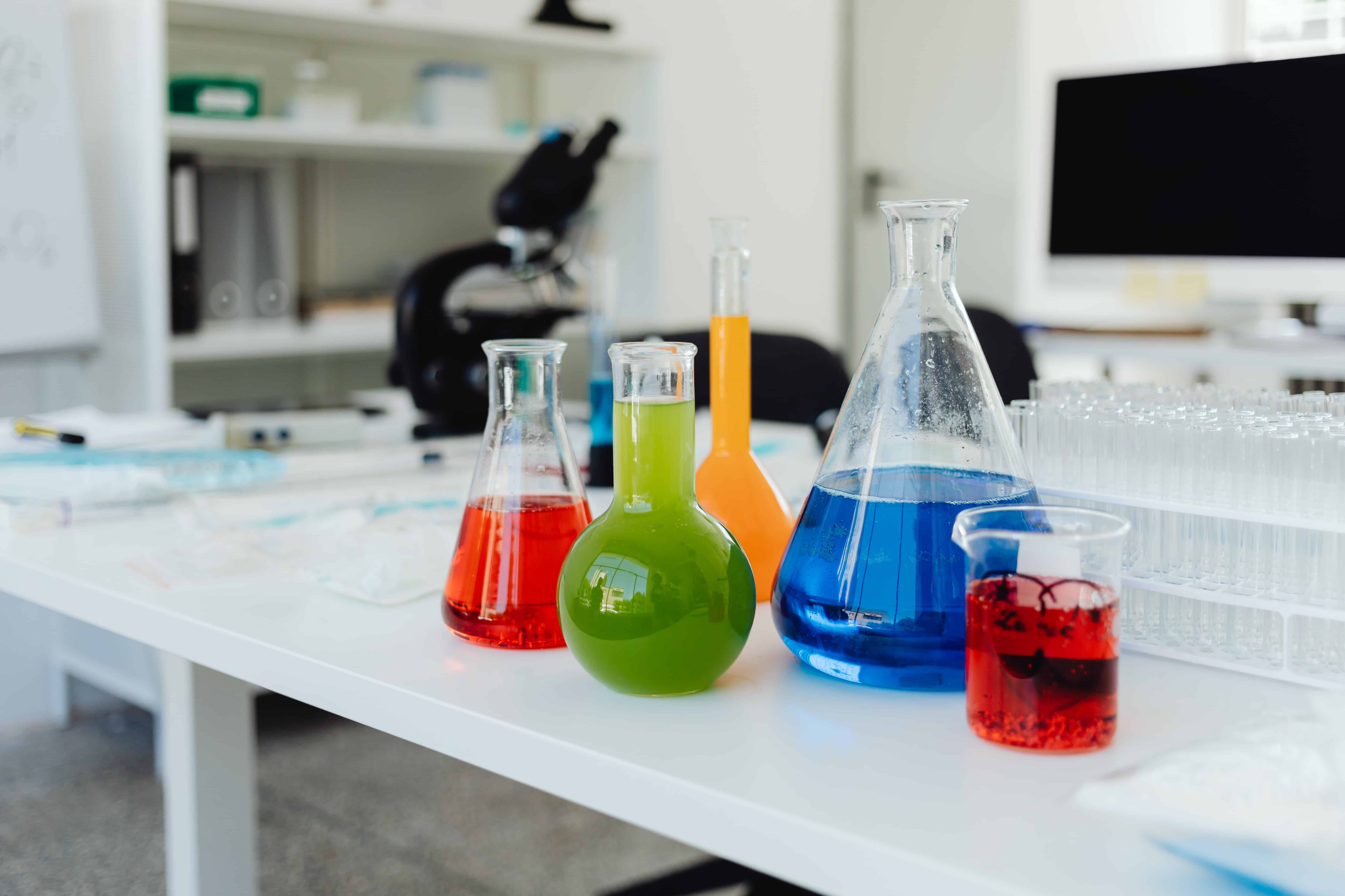 chemistry flasks filled with colourful fluids.