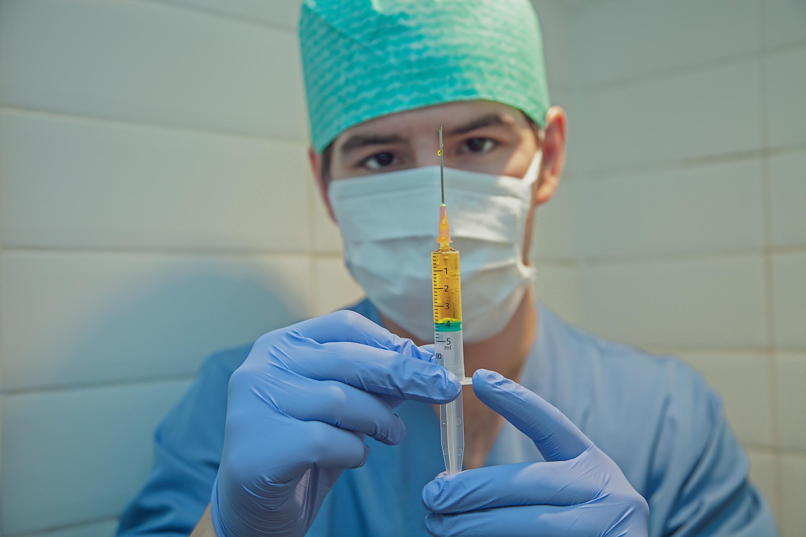 a nurse prepares a syringe