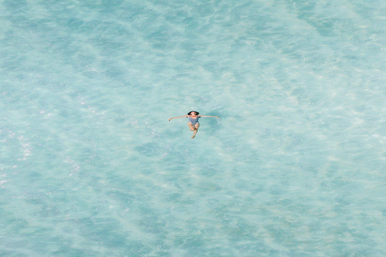 A man swimming in the pool