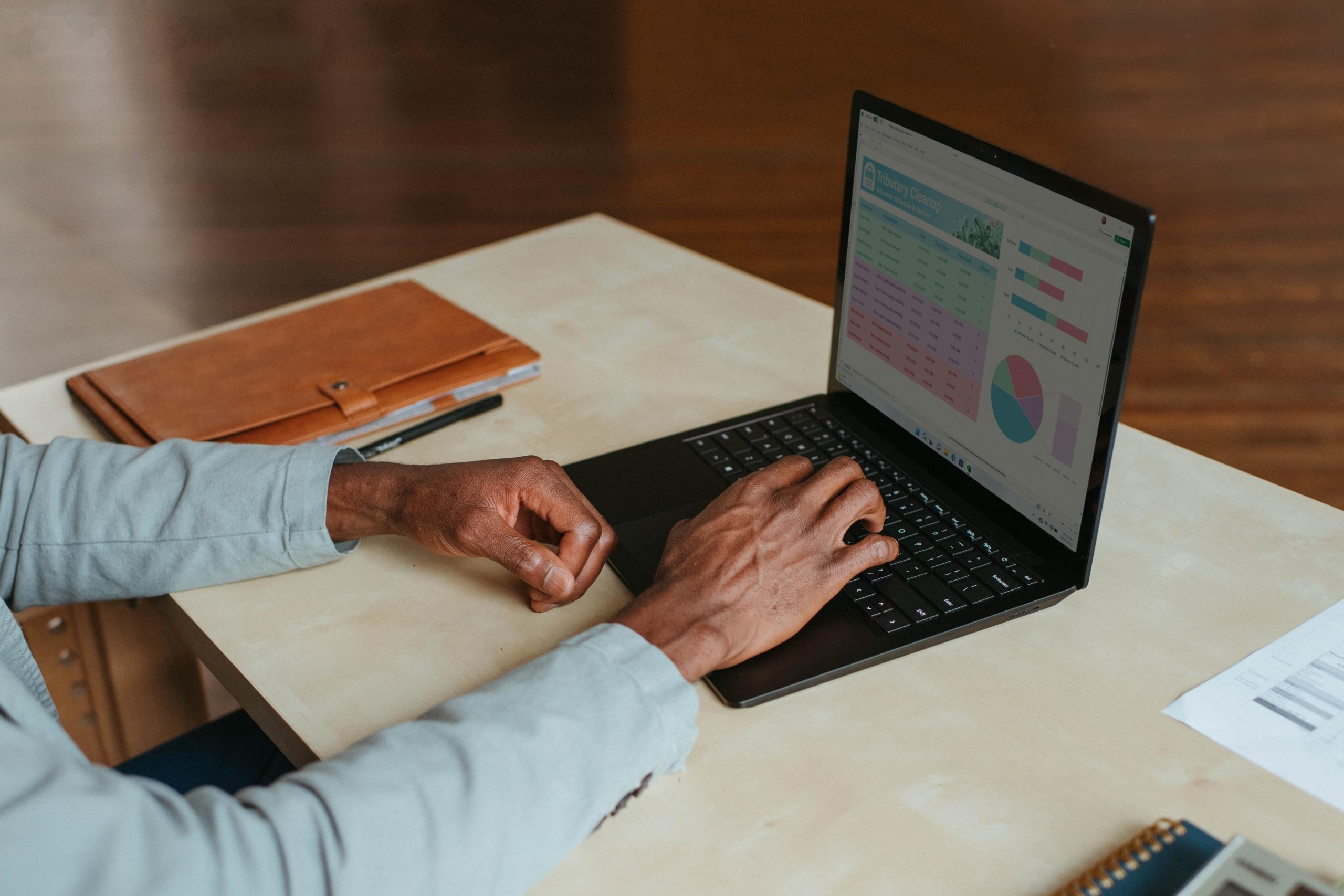 a finance professional at the computer with cryptocurrency