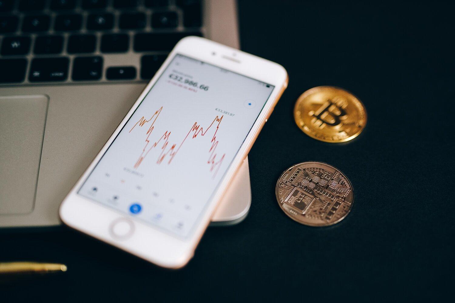 A snaphot of a smartphone and bitcoins