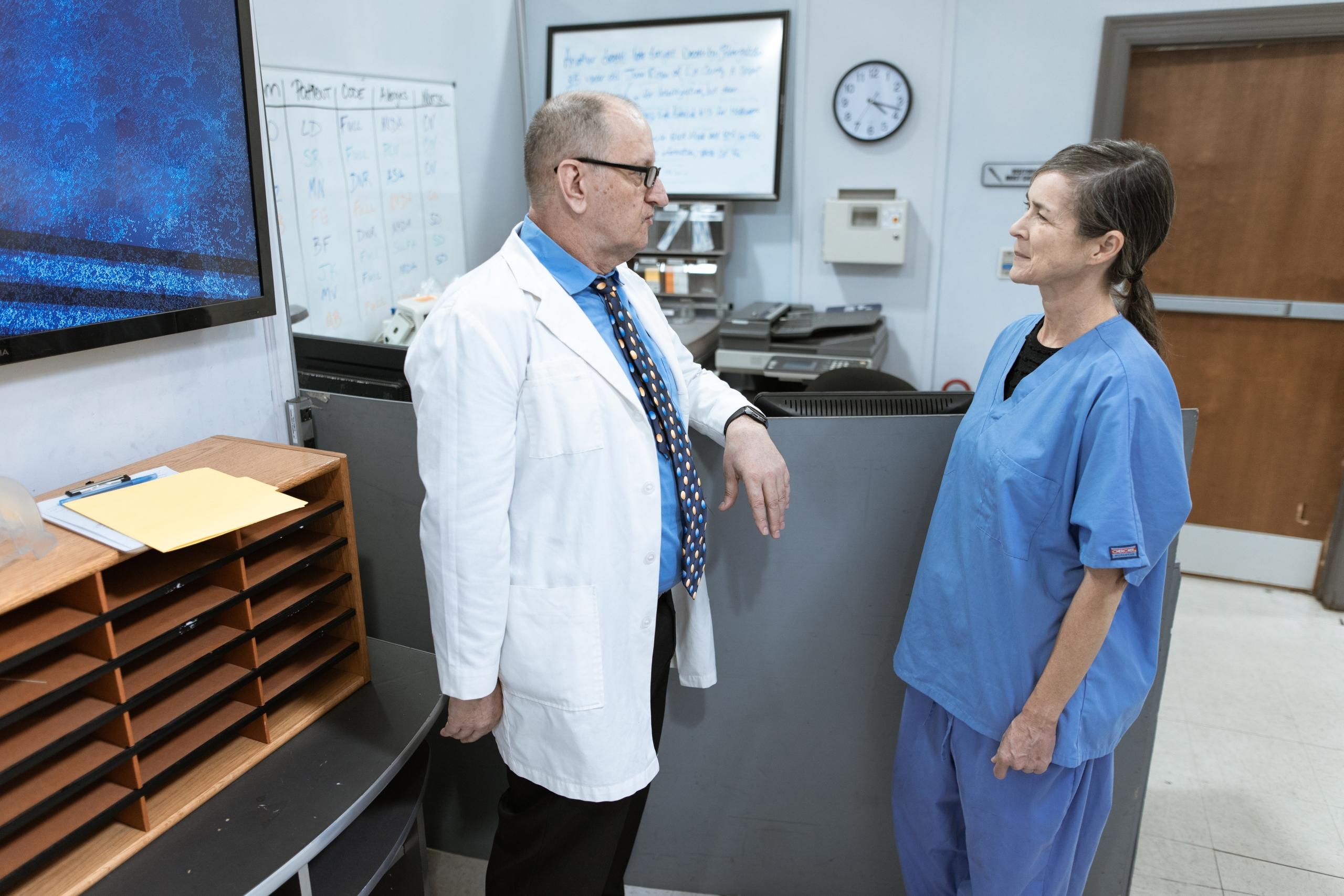 A nurse and a doctor collaborate.