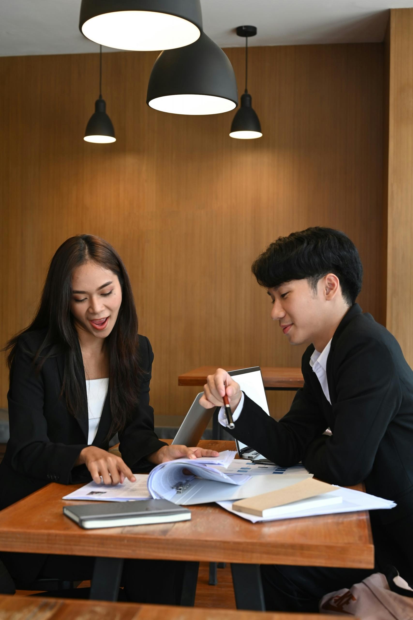 two family lawyers reviewing a case together at a desk