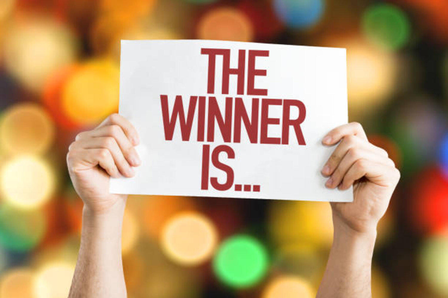 A playcard with an inscription "THE WINNER IS..."