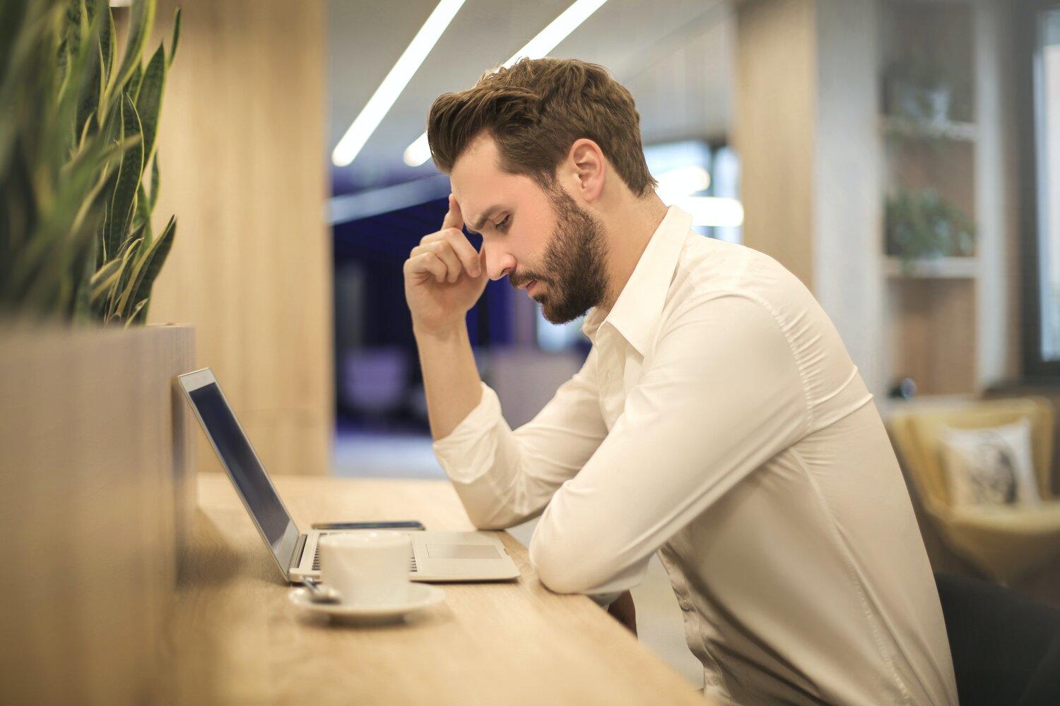 A man looking at laptop