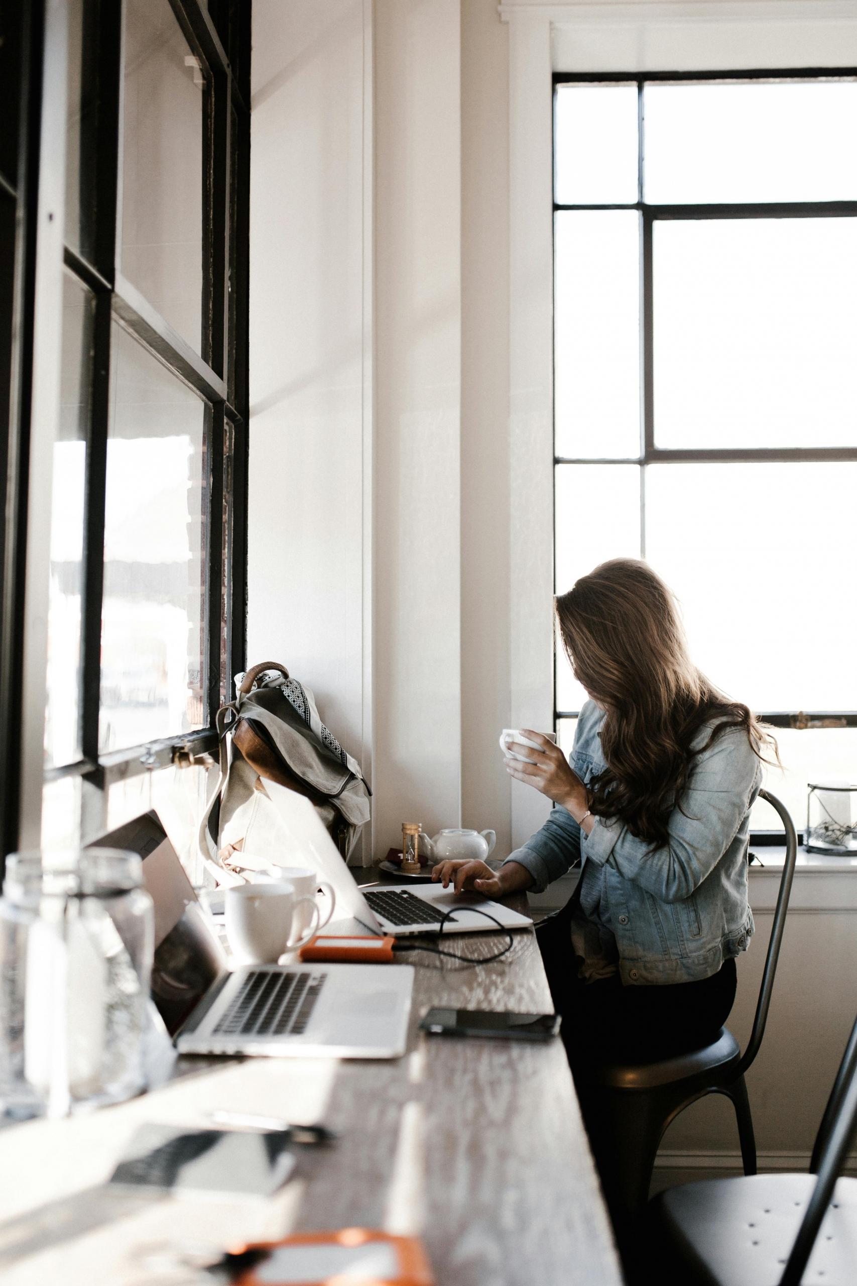A women sitting at a cafe studying for law school.