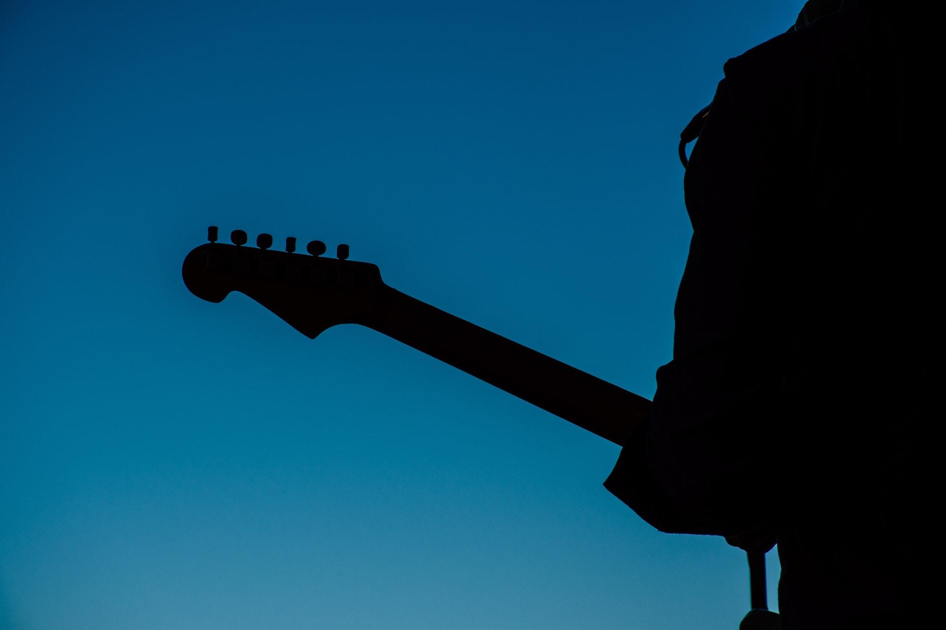 black and blue silhouette guitar