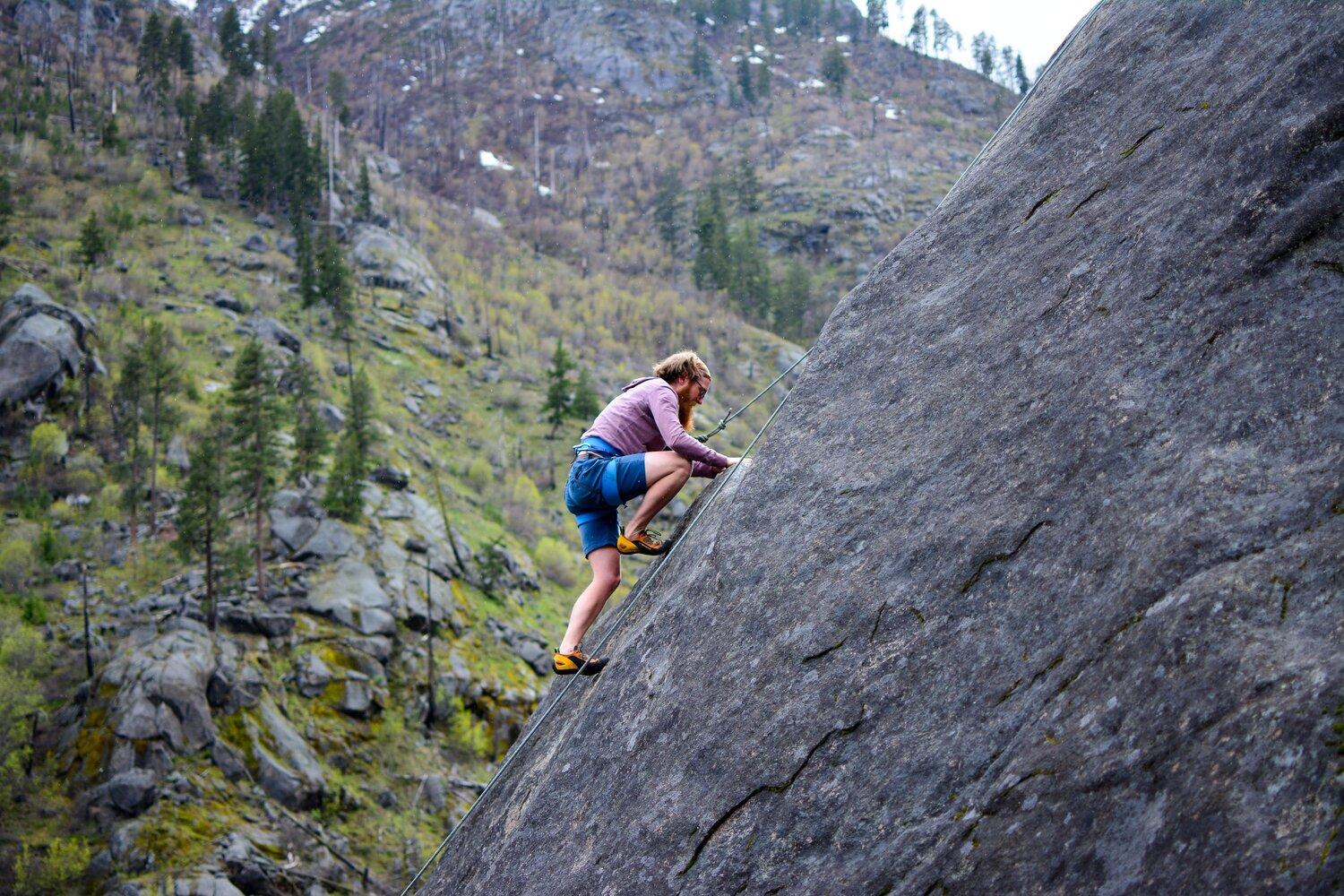 A man climbing a mountain