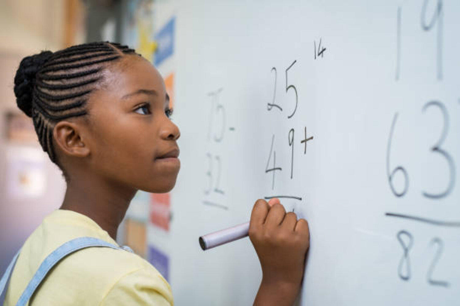 A girl writing on whiteboard
