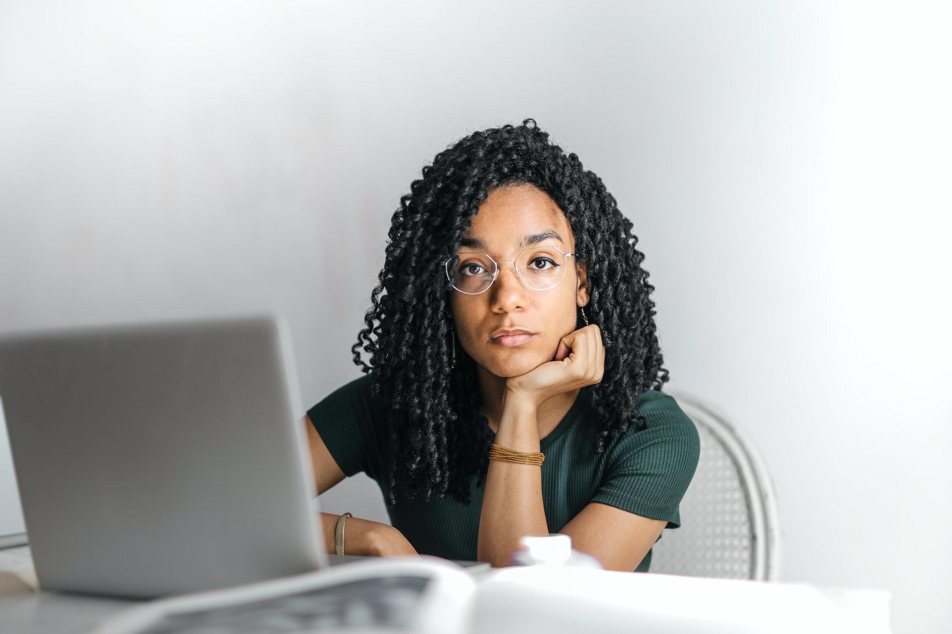 Women working on computer staring 
