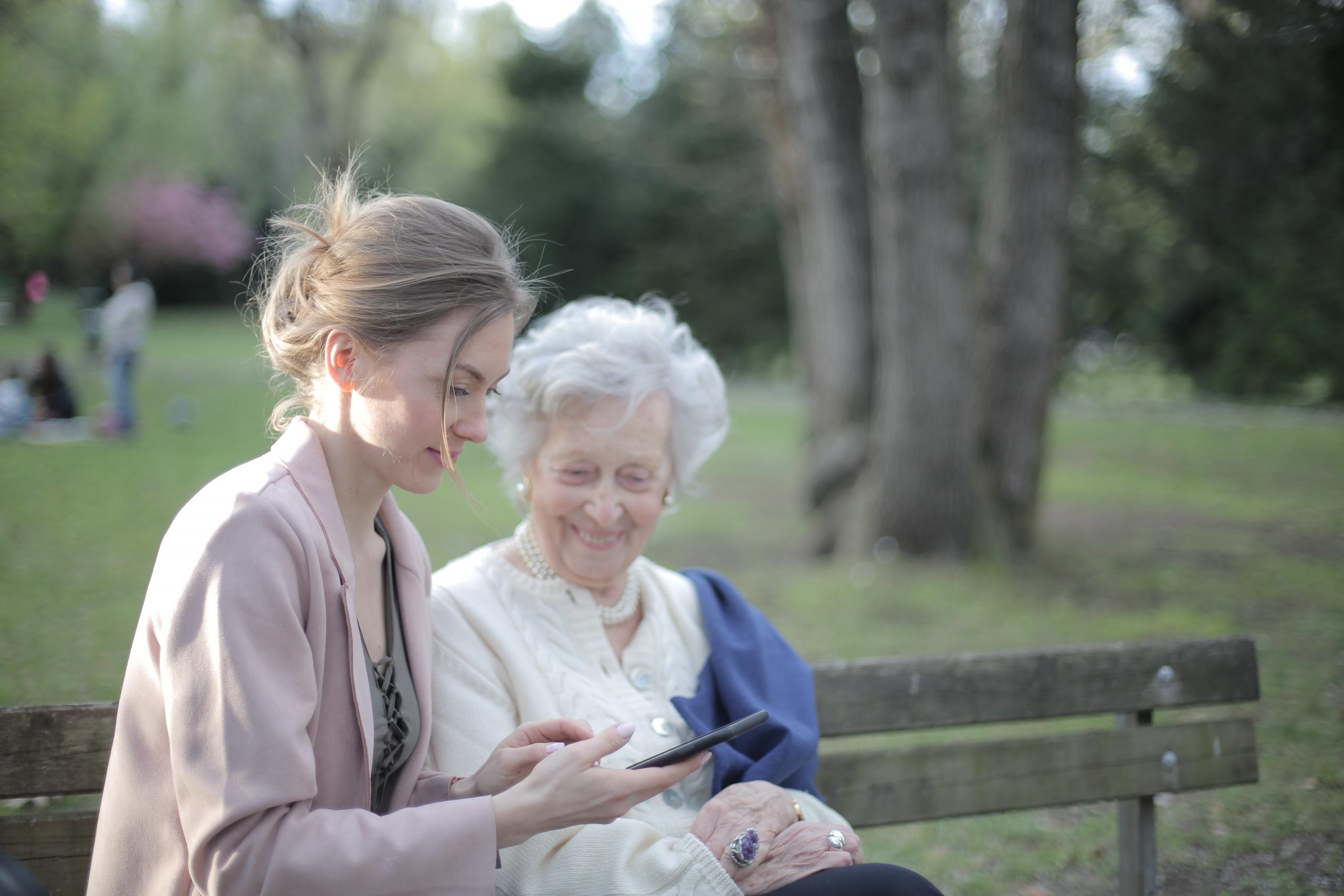 An elder teaches a young person.