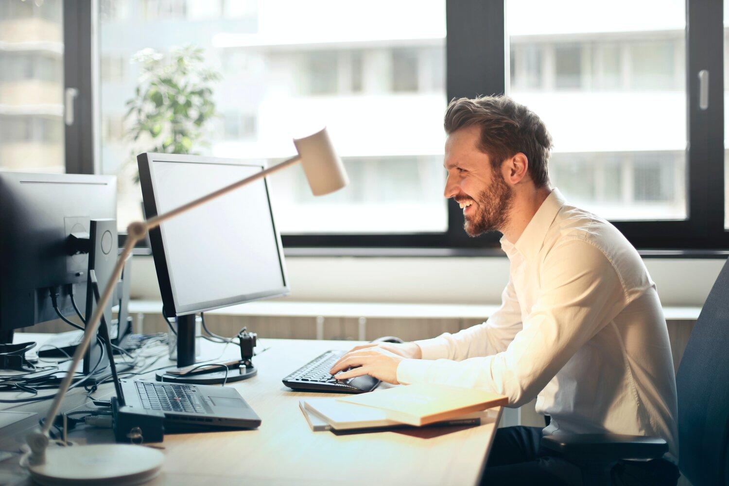 A man staring at computer screen