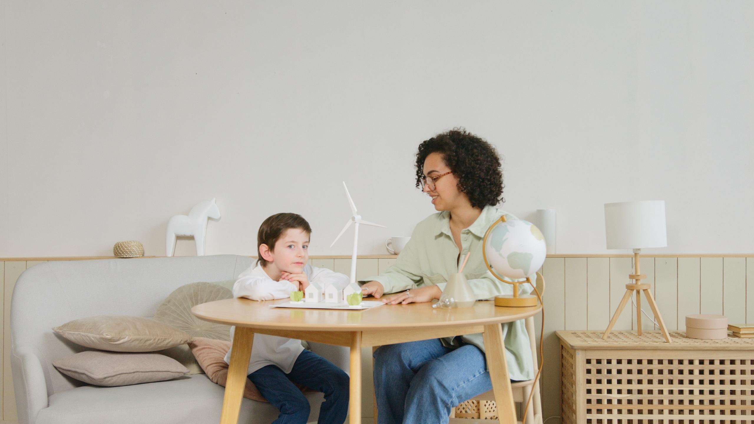 A science tutor works with a child.
