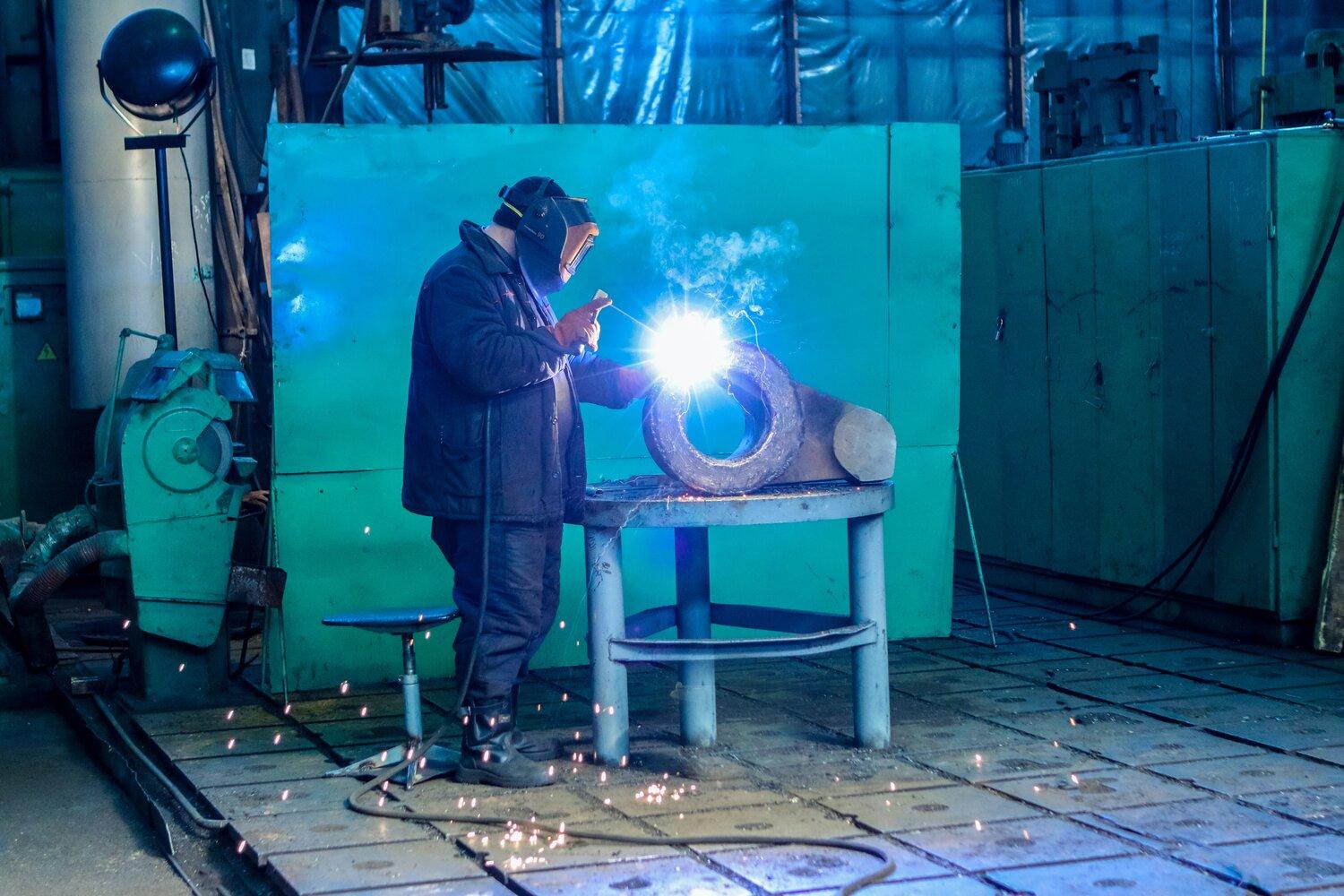A man in a metal factory.