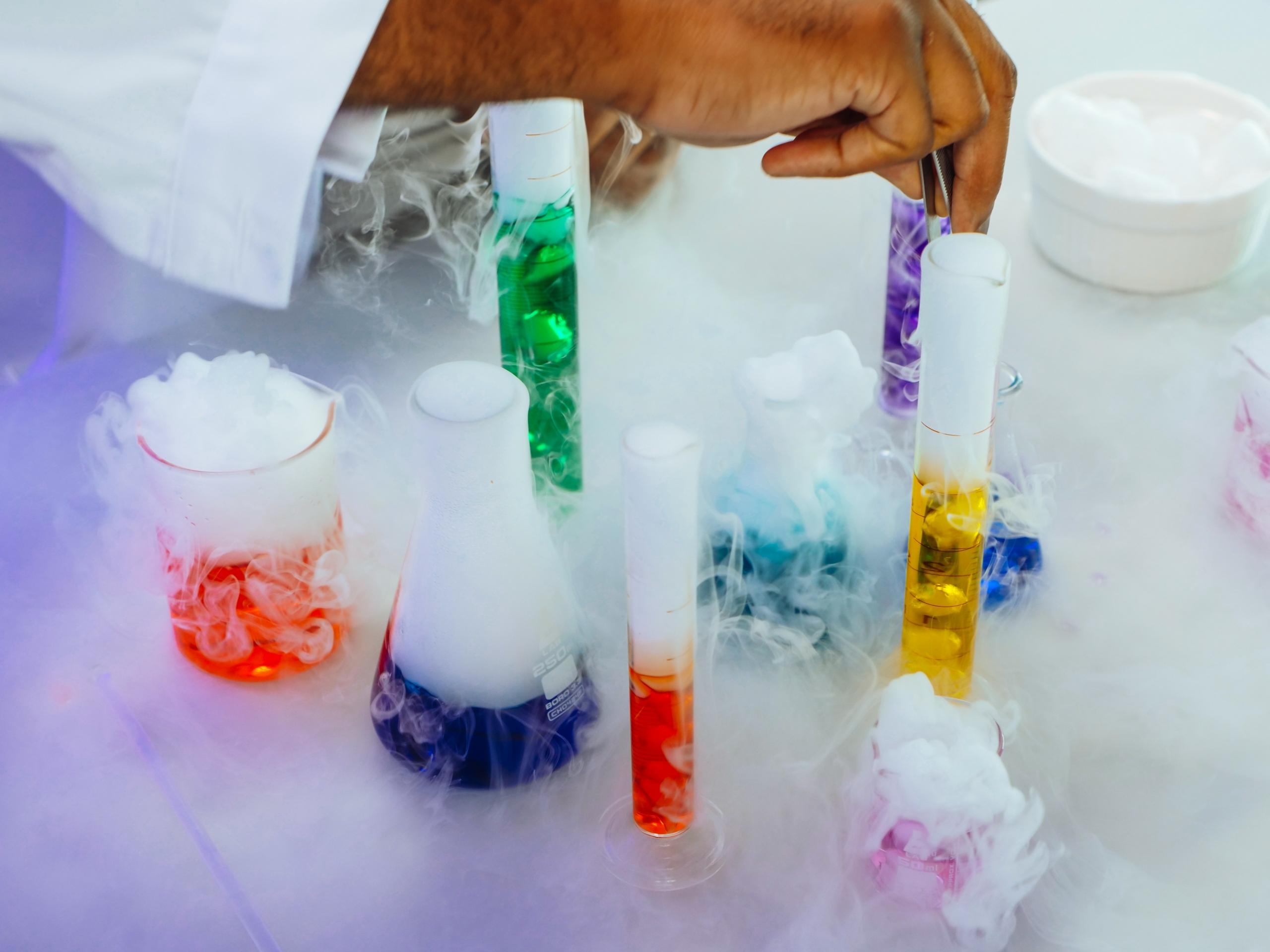 a variety of beakers filled with coloured liquids.