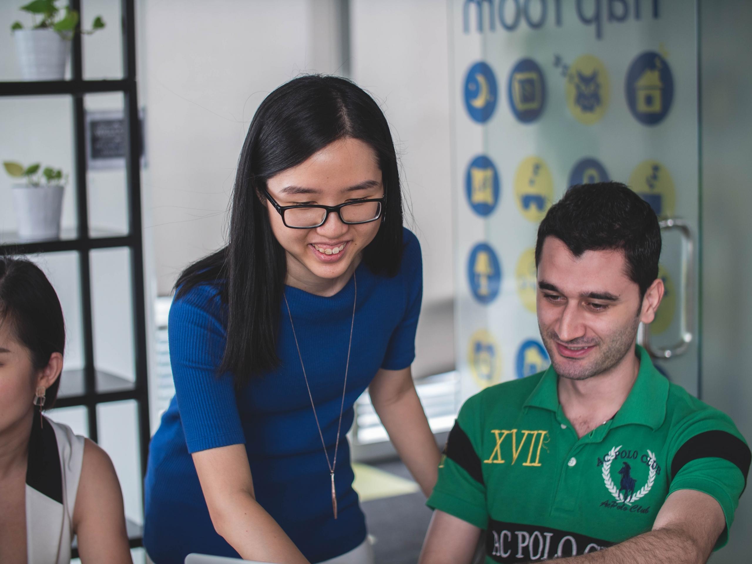 A Chinese education professional works with a student.