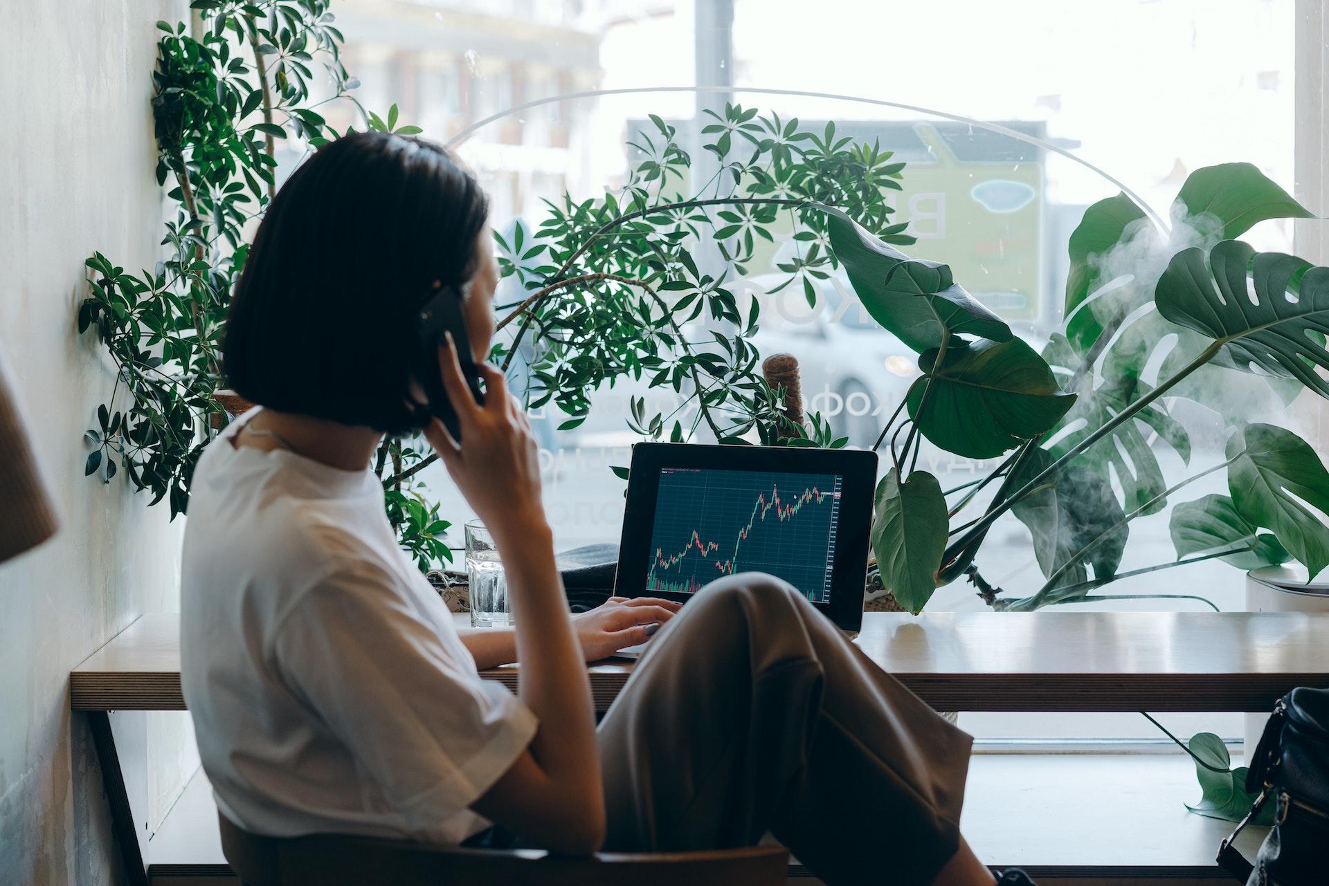 lady on the phone tracking finances