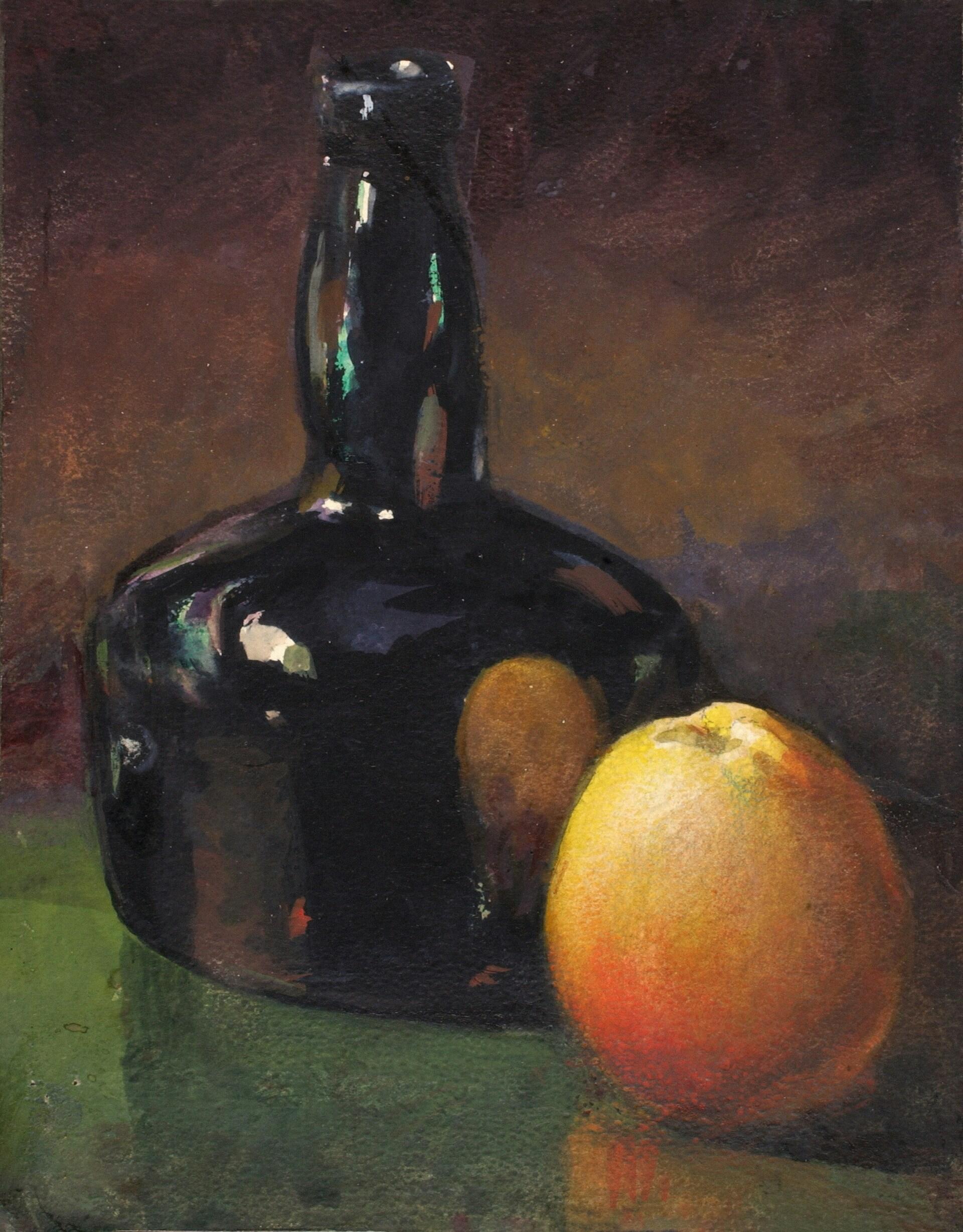 A dark glass bottle sits next to two oranges on a green surface with a dark background.