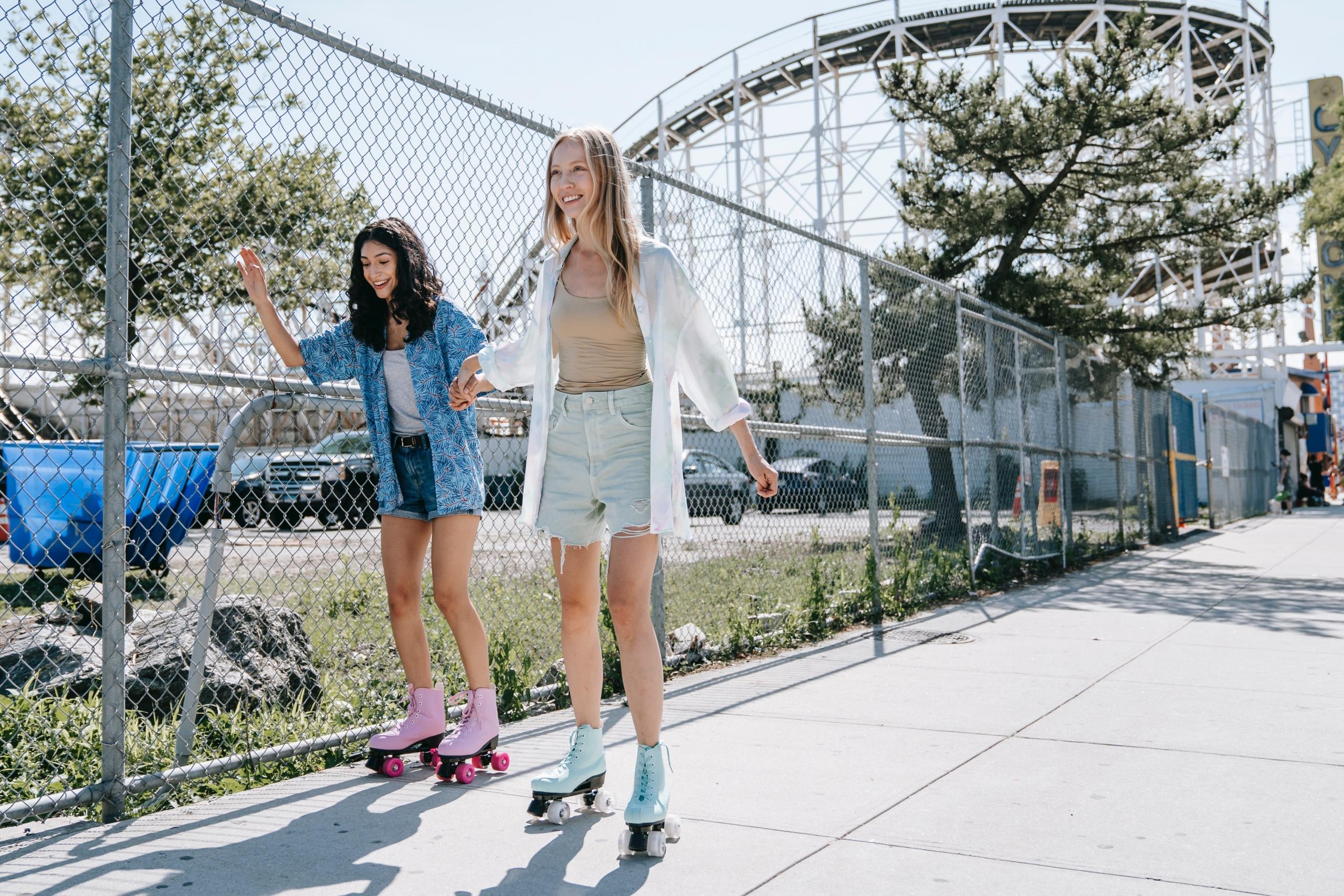 Friends skate at an amusement park.