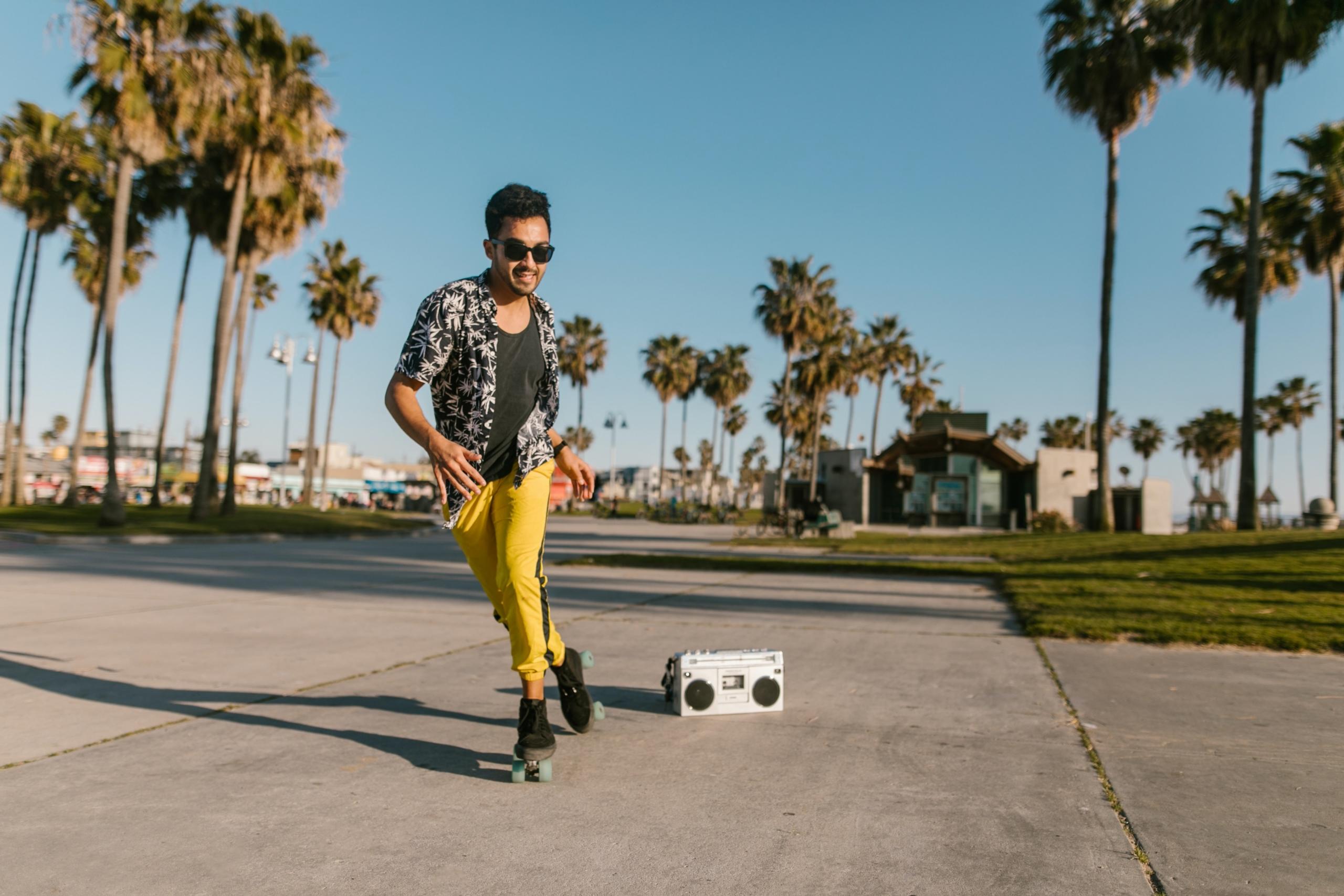 A man roller skates while listening to music.