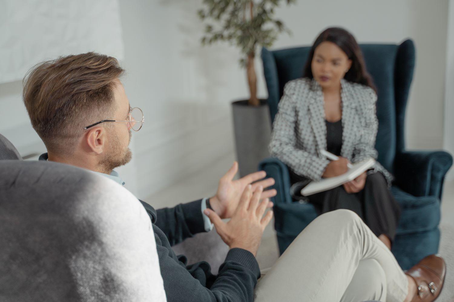 A woman interviewing a man