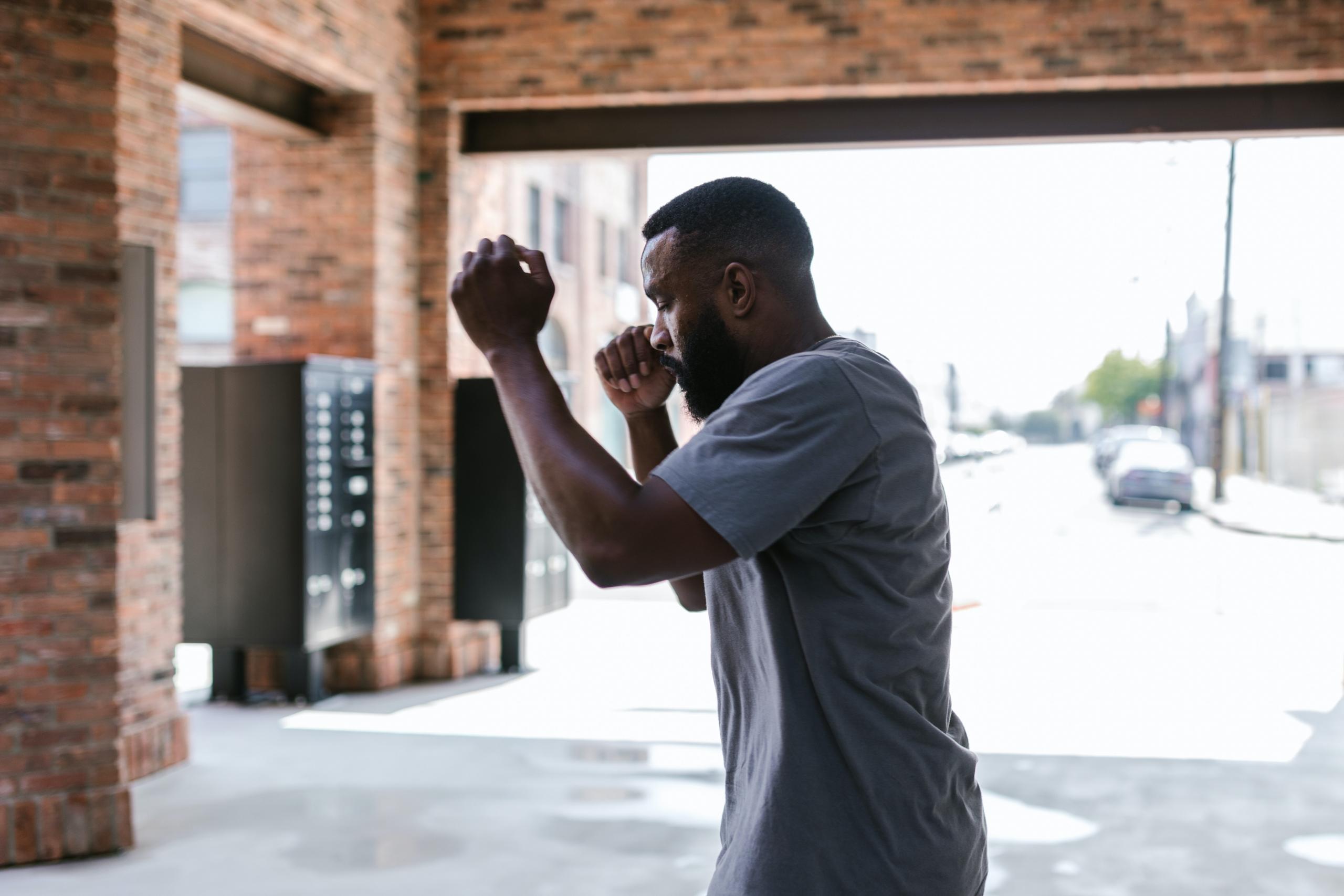 a man punches the air.