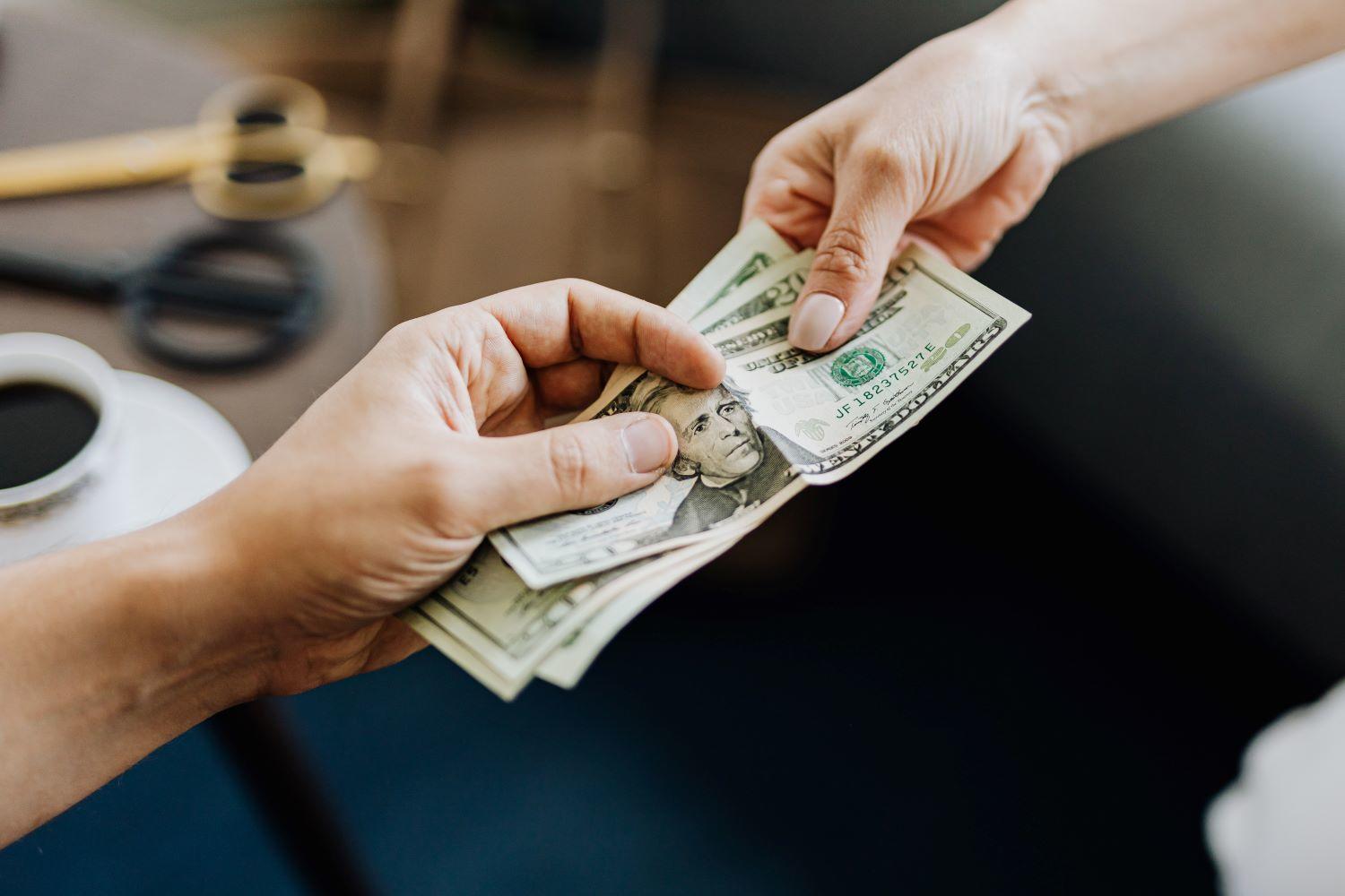 Two people exchanging money