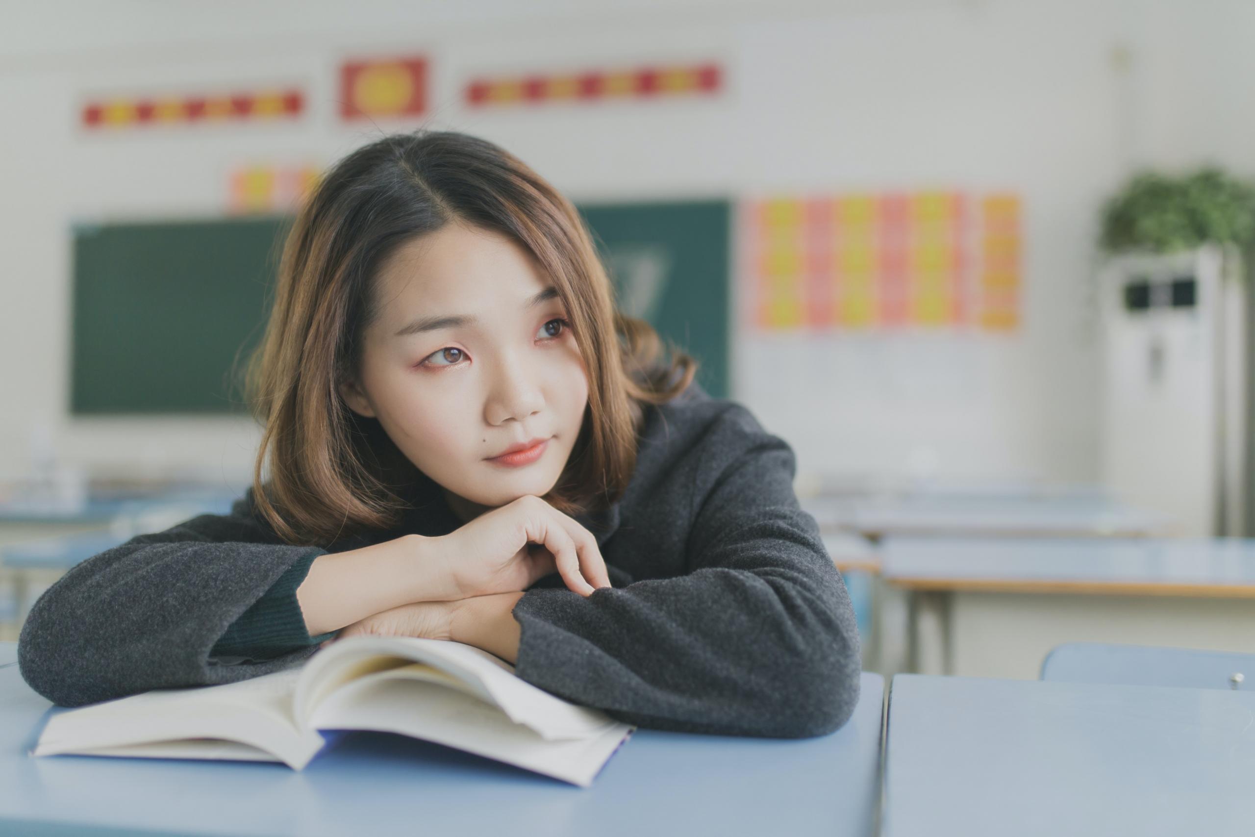 a korean student reading a book