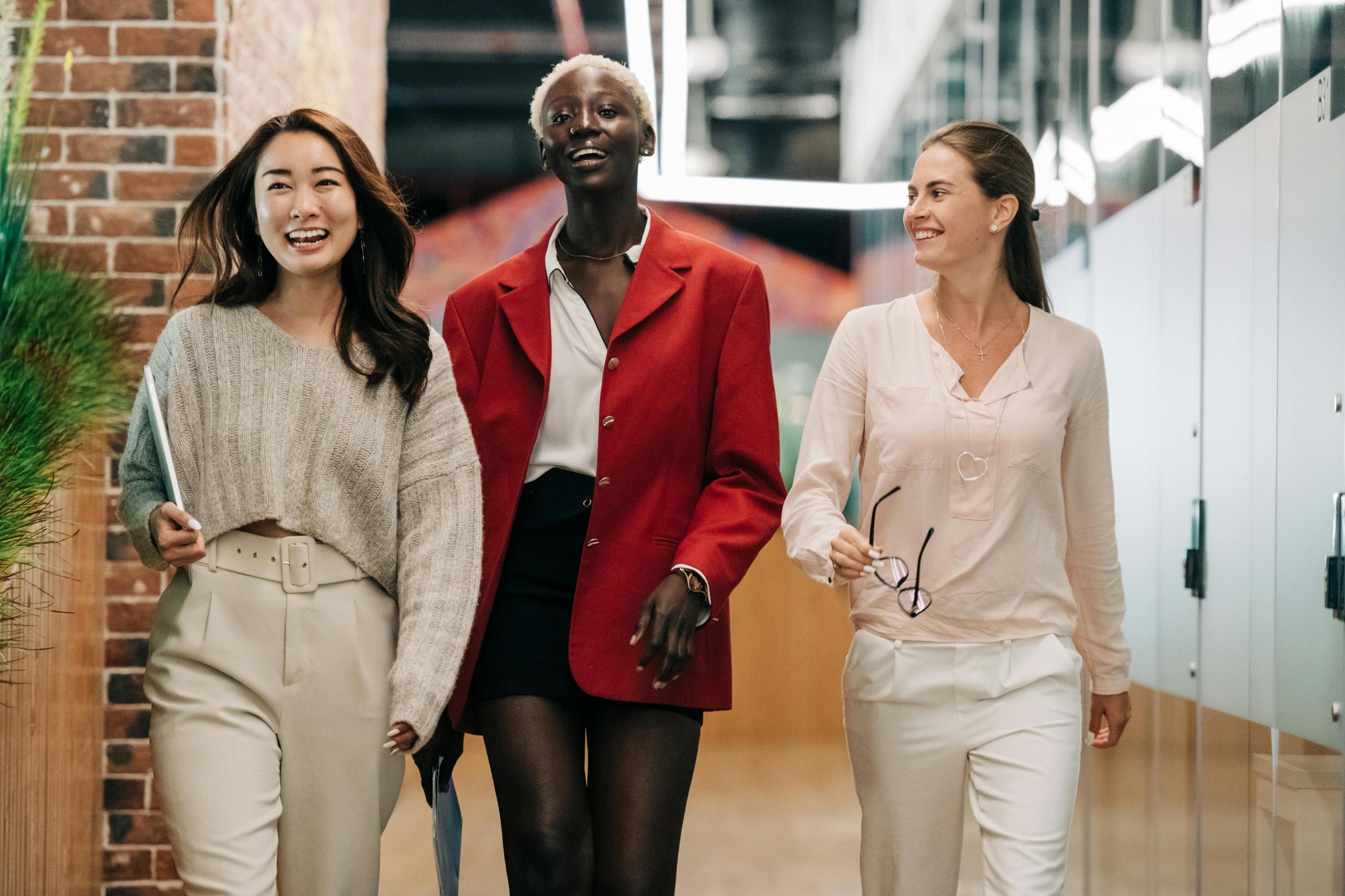 a group of professionals walk in the office.