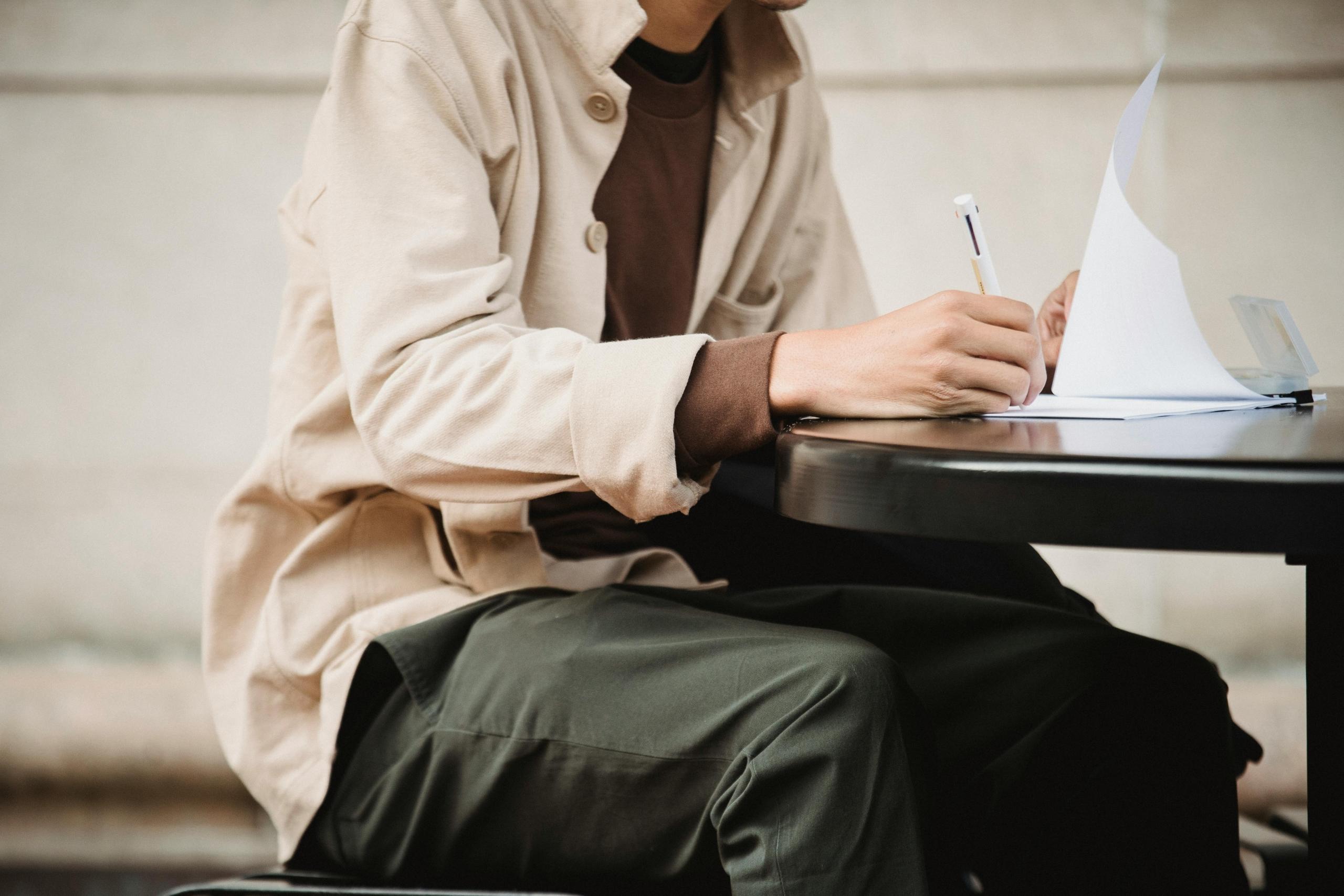 a person studies at a table.