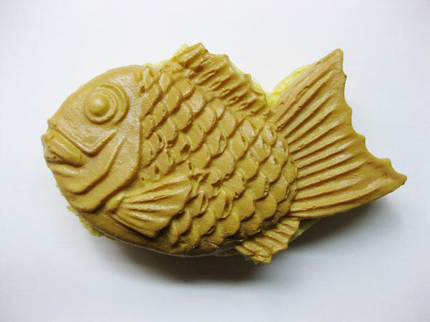 Dessert is shaped like a fish and is made of a crispy pastry filled with red bean paste.