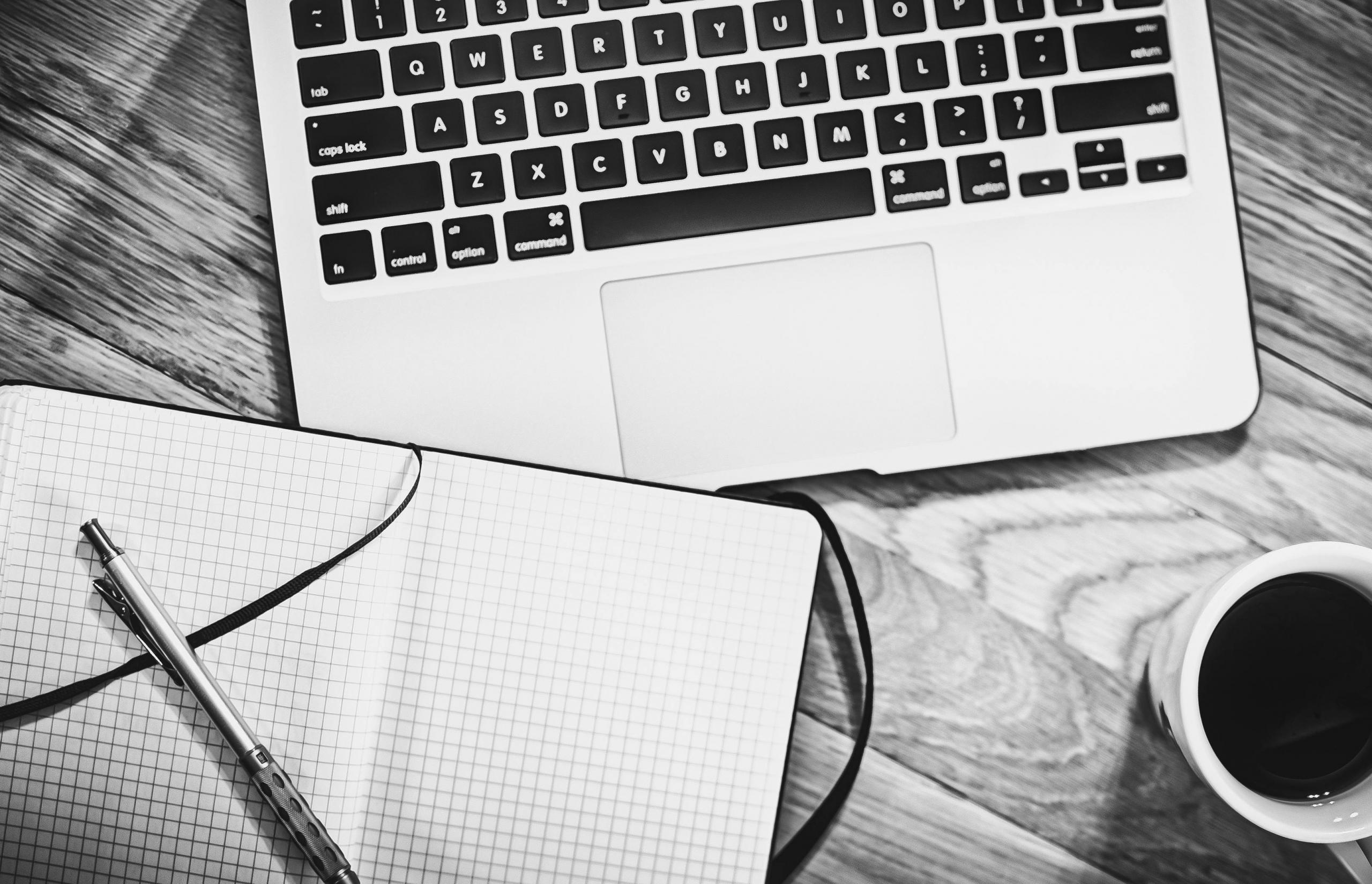 a notebook and a laptop