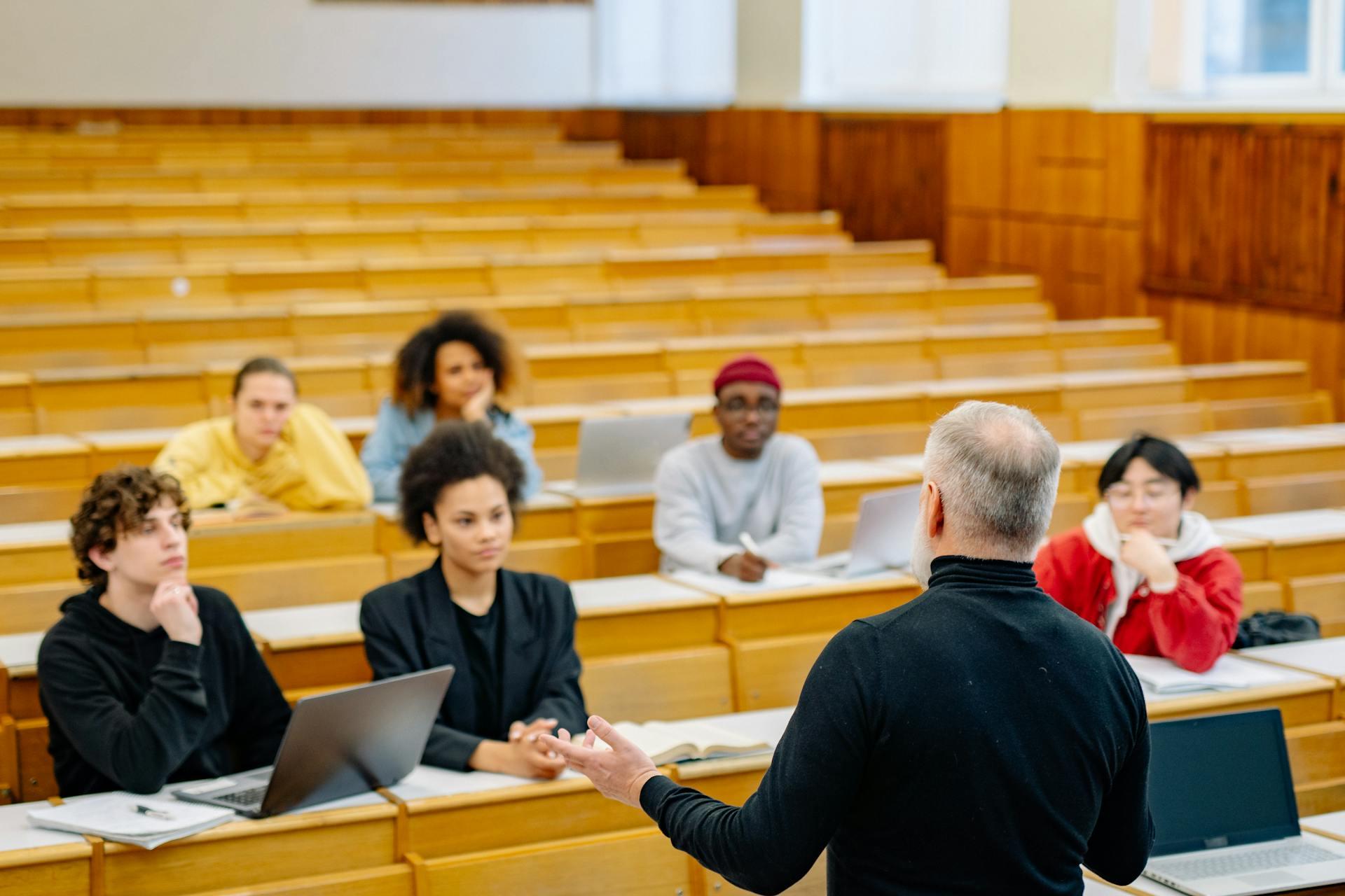 Financial Analysis students and their professor in classroom