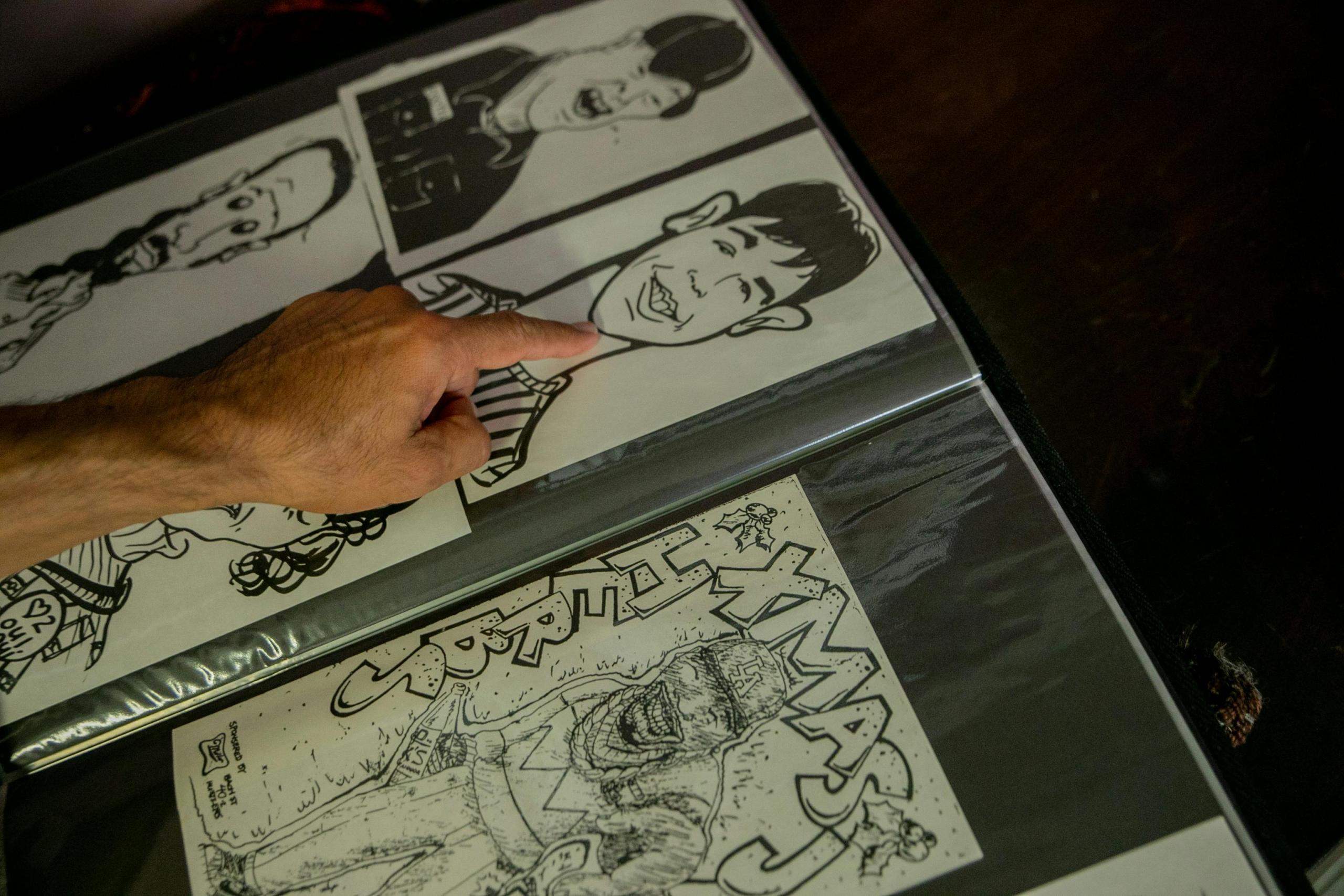 A page of caricature drawings in a notebook. 