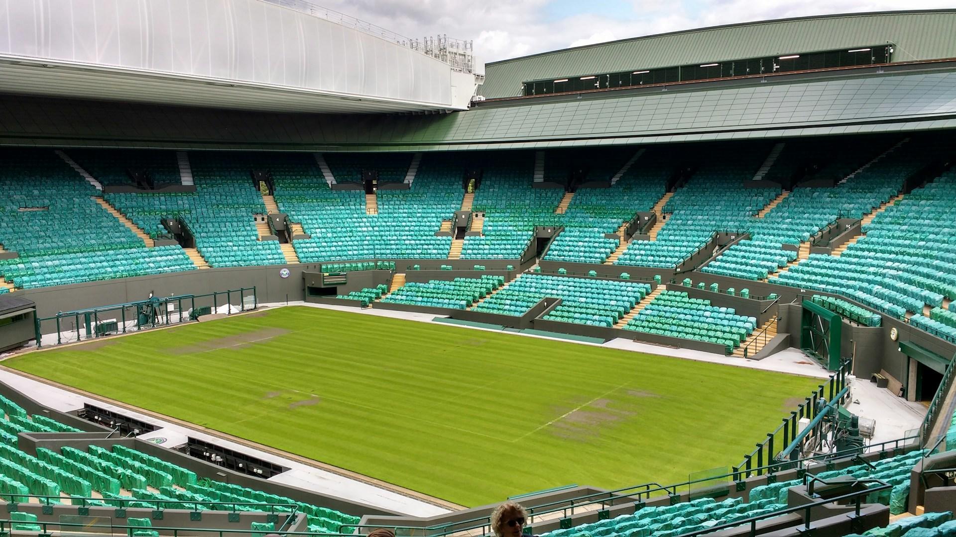 Wimbledon's tennis court empty of its audience and players.