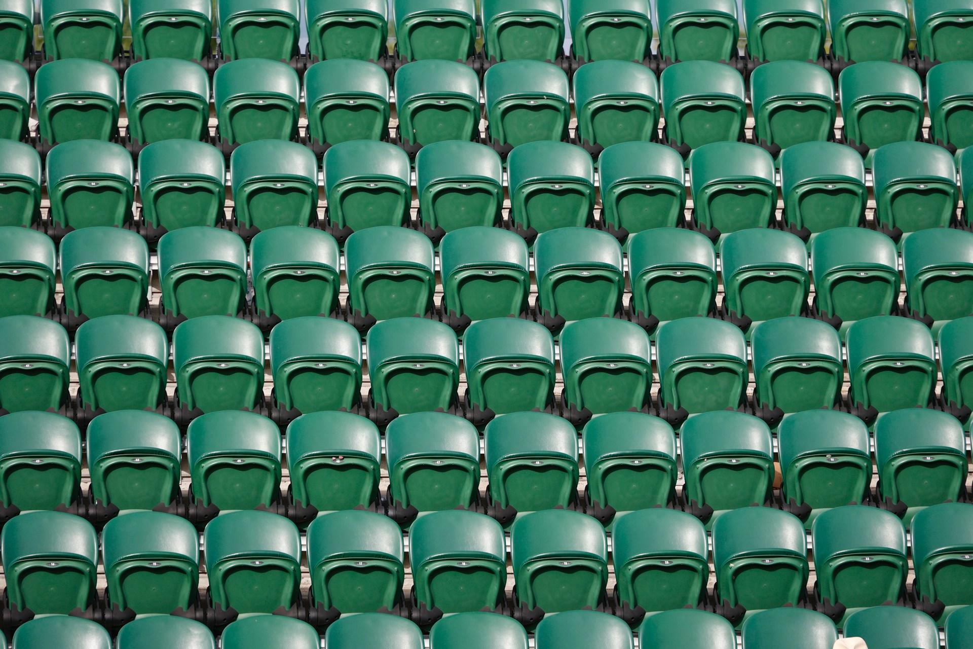 Sitting area of the tennis court at Wimbledon, just waiting to be filled.