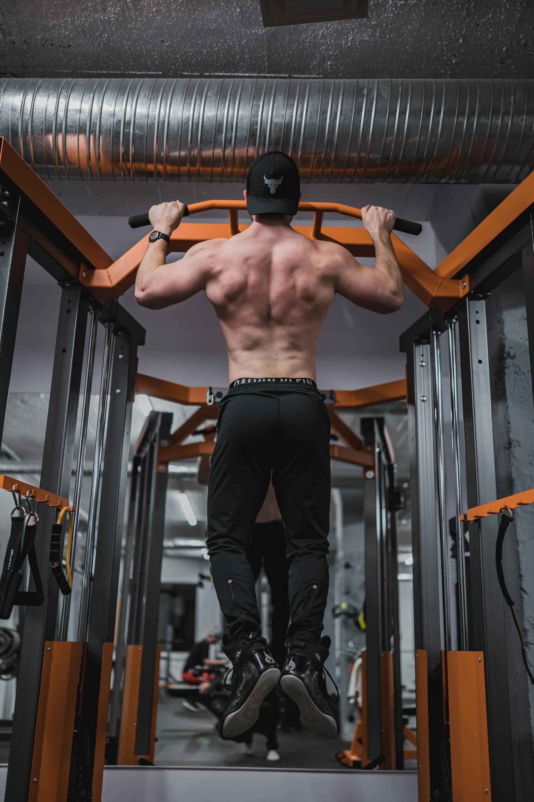 A man doing chin ups as and showing his Calisthenics Skills.