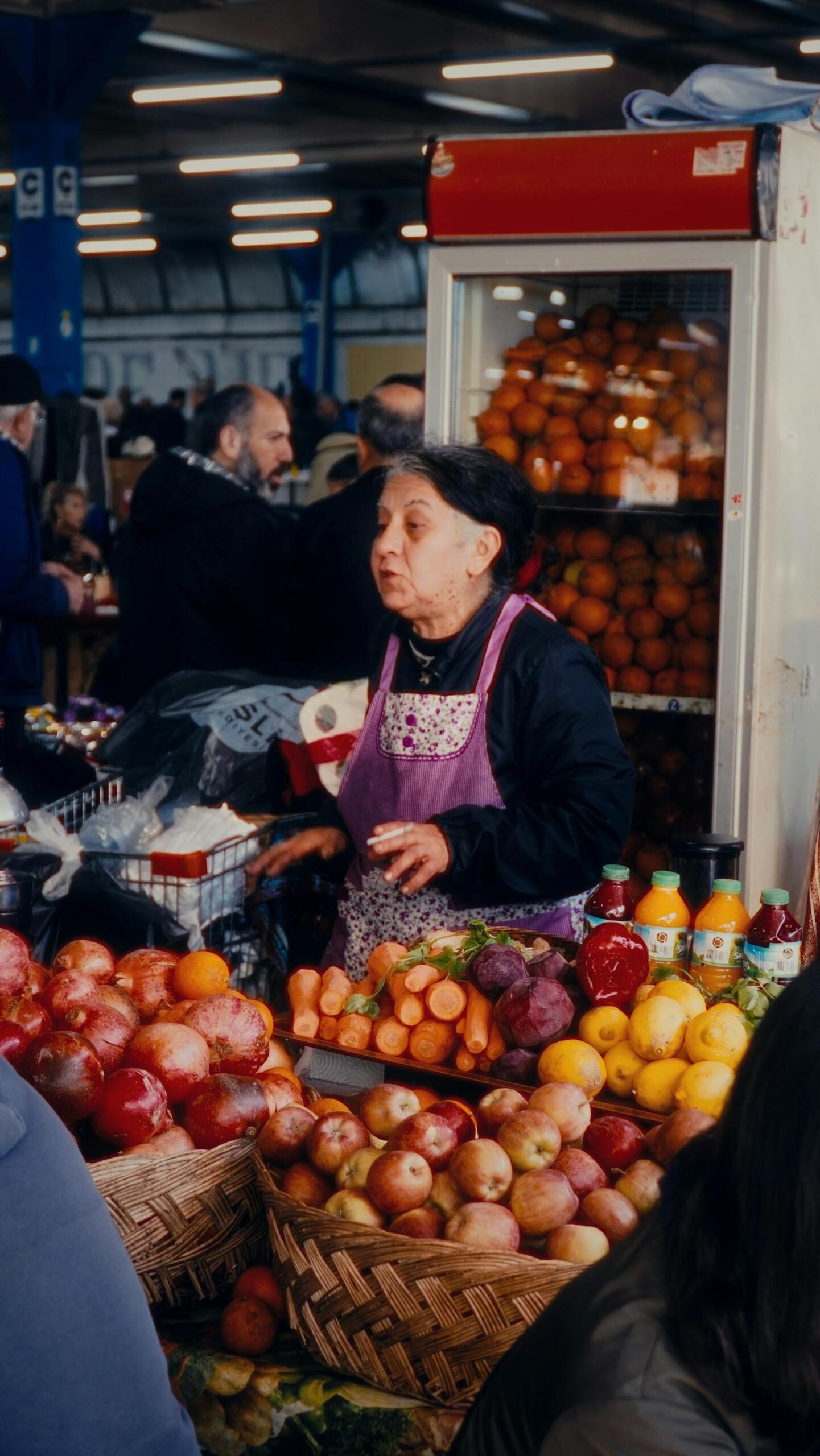 Fruit Market Vendor at Indoor Market Selling Fruits and Vegetables.