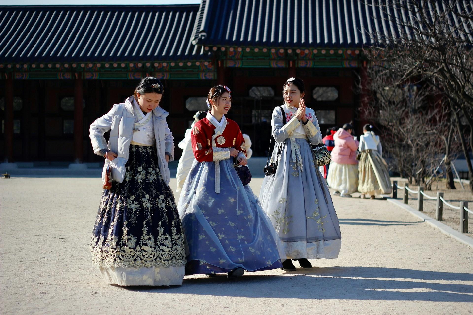 Three women wearing the traditional Korean hanbok.