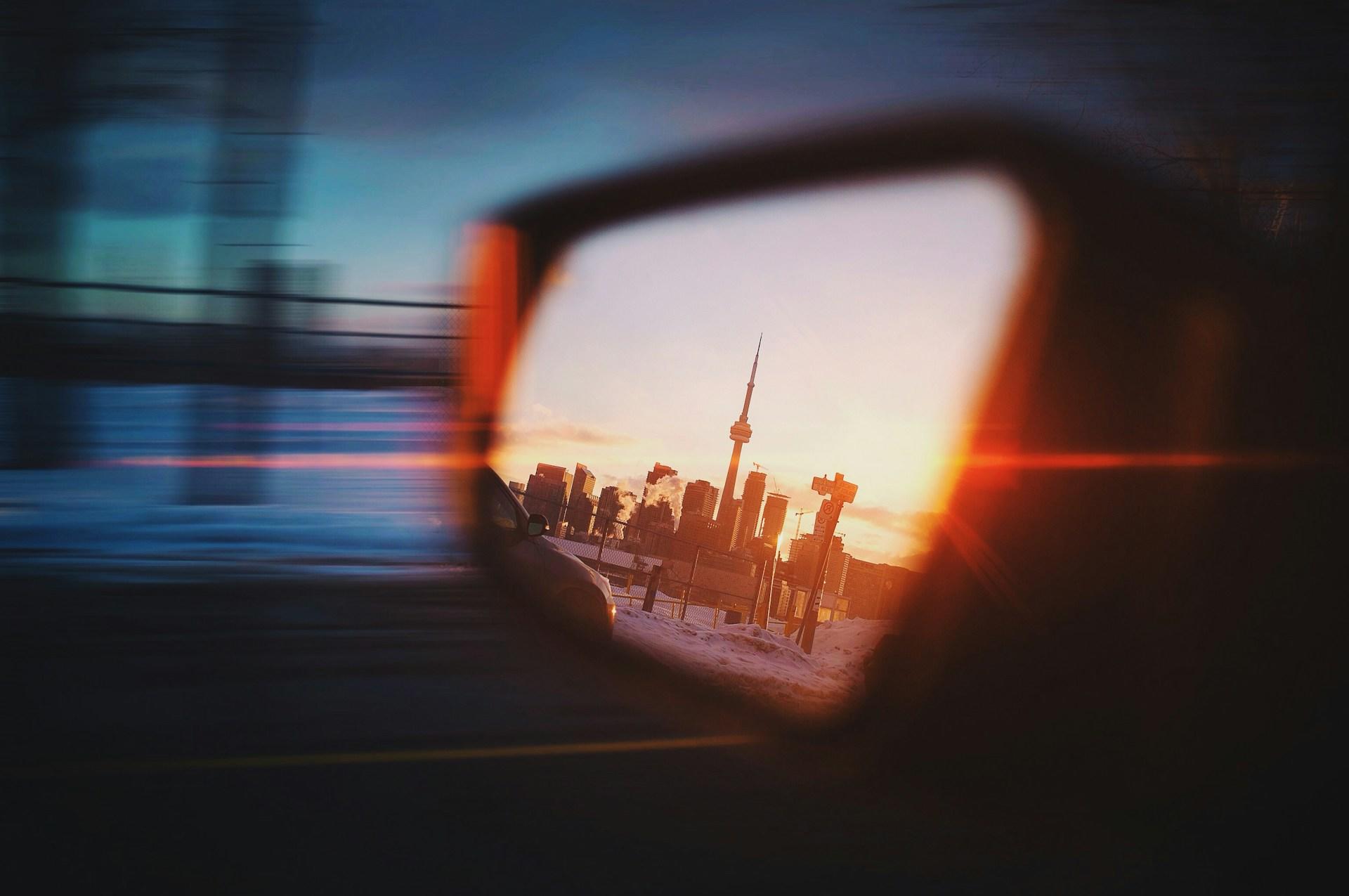 Toronto skyline on a side mirror of a car after a Graphic Design class.