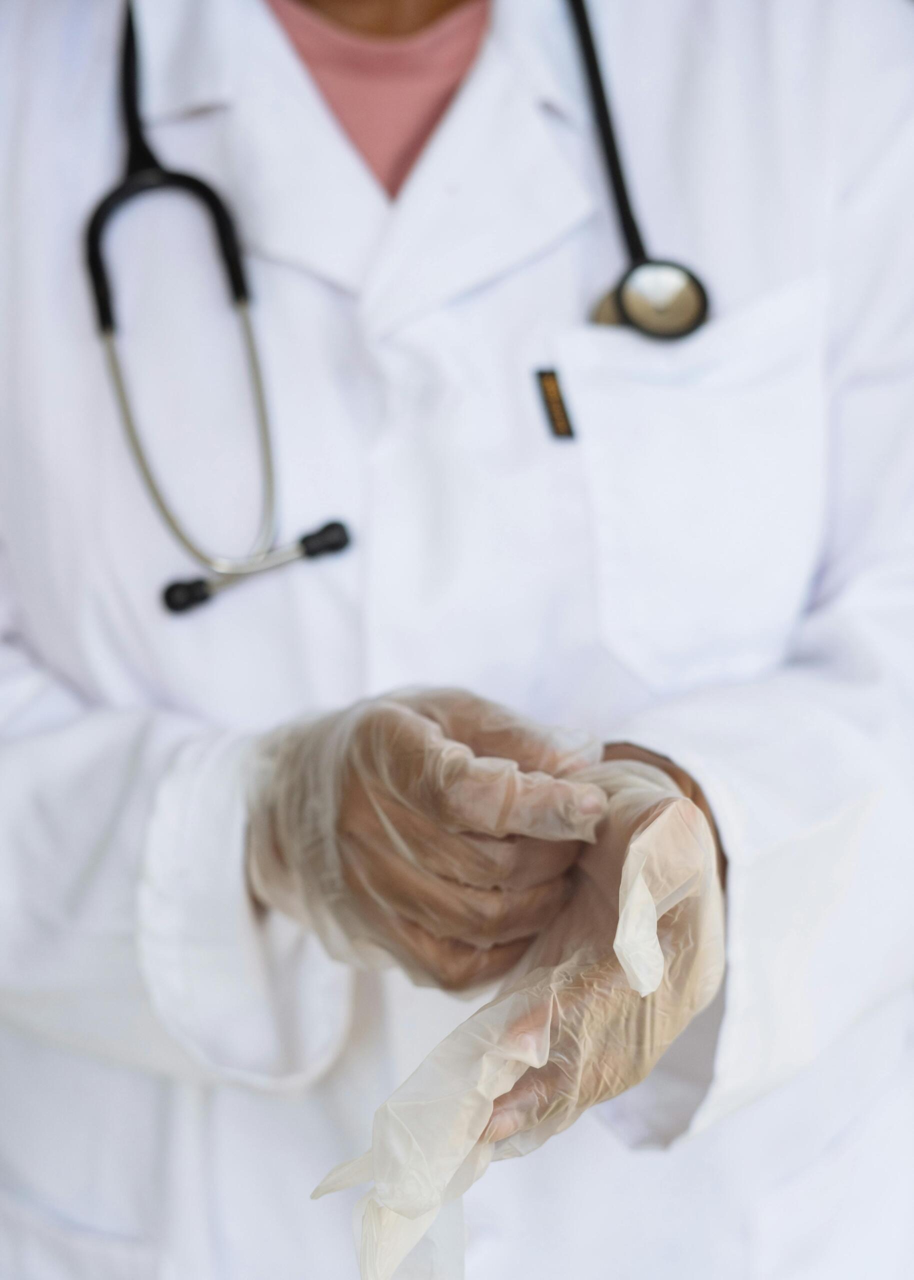 a close up photo of a nurse putting on gloves. Source: Retha Ferguson.